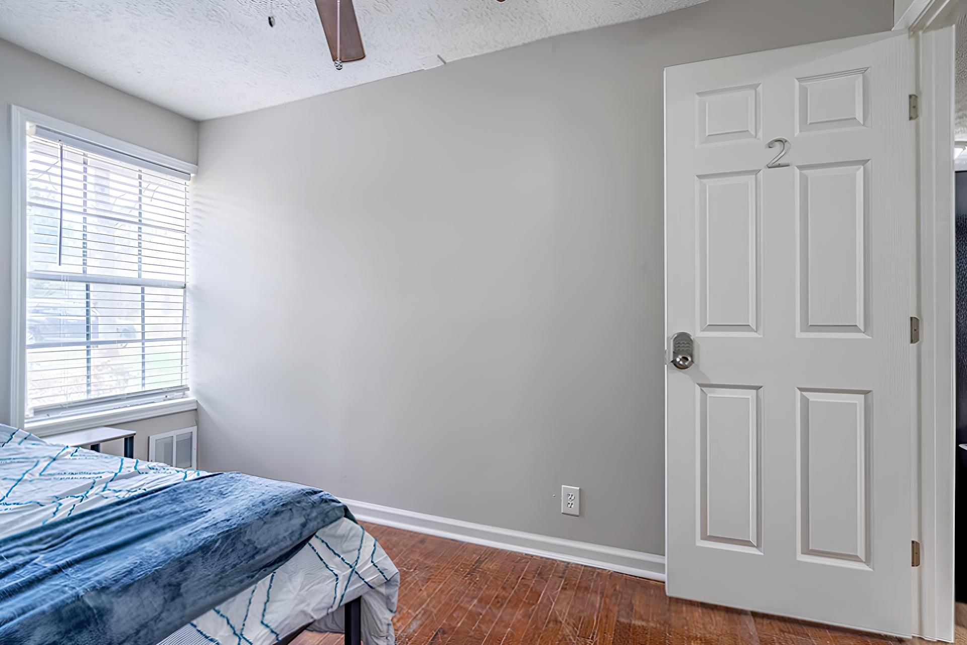 bedroom, detected:window blind, bed, ceiling fan