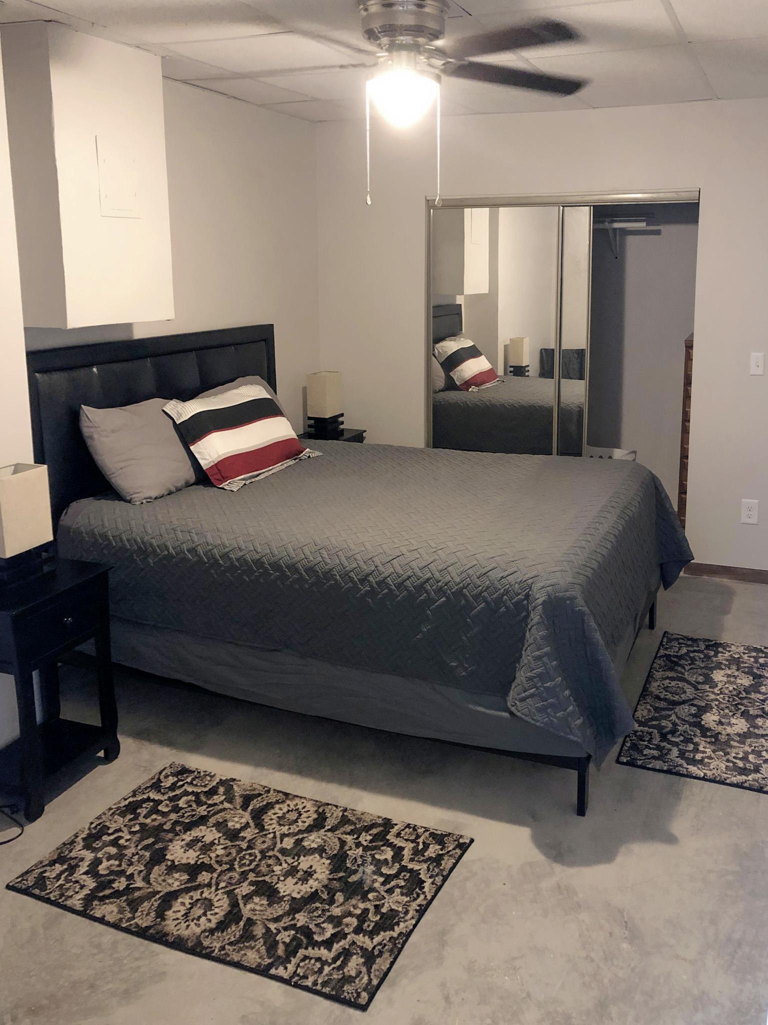 Queen bed with walk-in closet