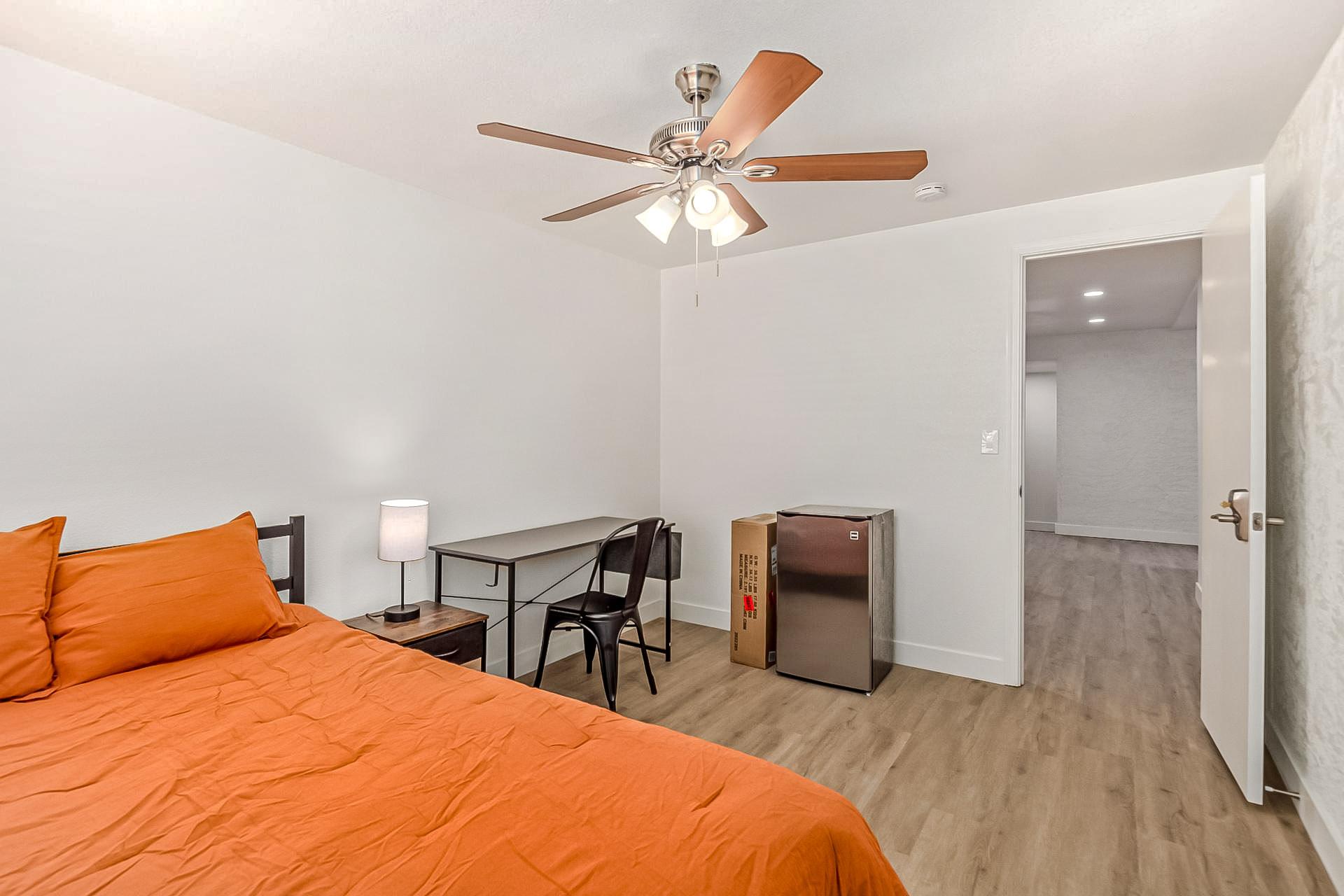 Full size bed, desk and chair and mini fridge.