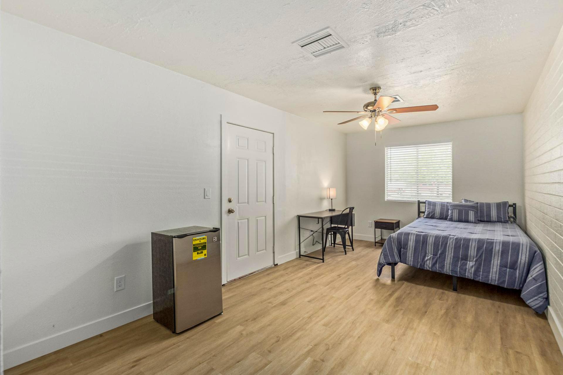 Bedroom #5 with full closet and separate entrance.
Desk, chair and oversized bedroom.
private entrance with mini fridge