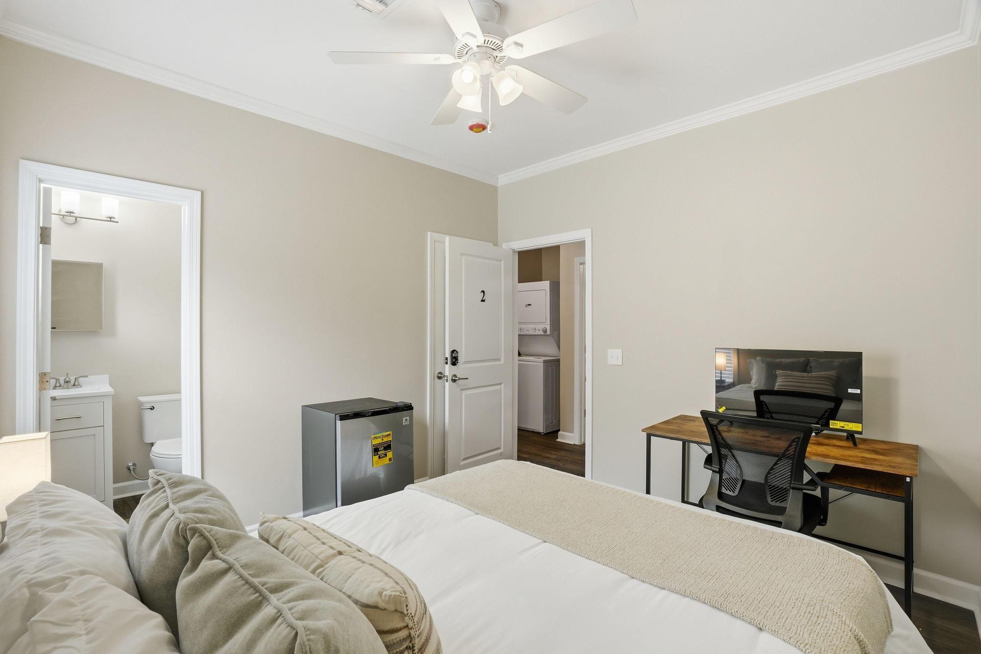 Queen bed, workstation with Roku TV, and mini fridge included! Mattress cover included. Bed linens not included