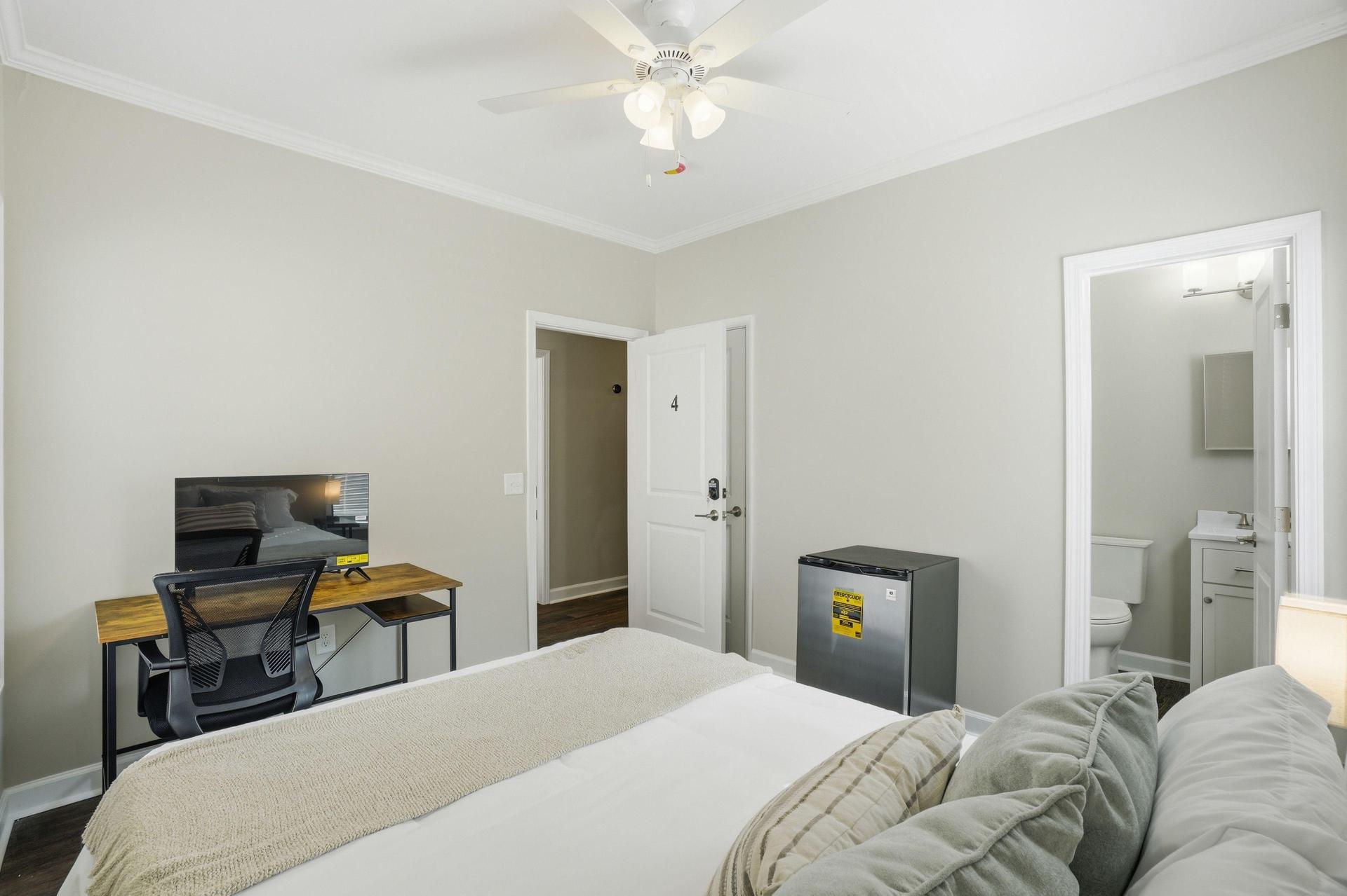 Queen bed, workstation with Roku TV, and mini fridge included! Mattress cover included. Bed linens not included