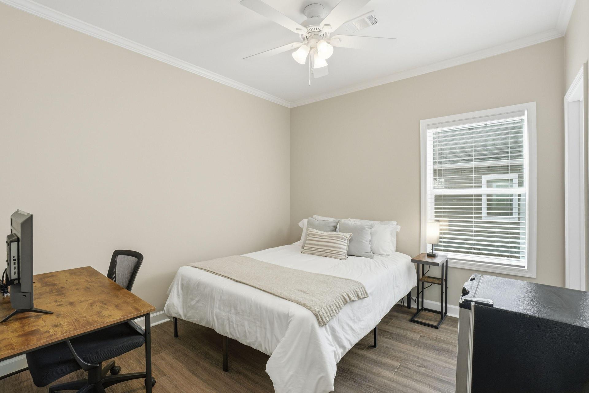 Queen bed, workstation with Roku TV, and mini fridge included! Mattress cover included. Bed linens not included