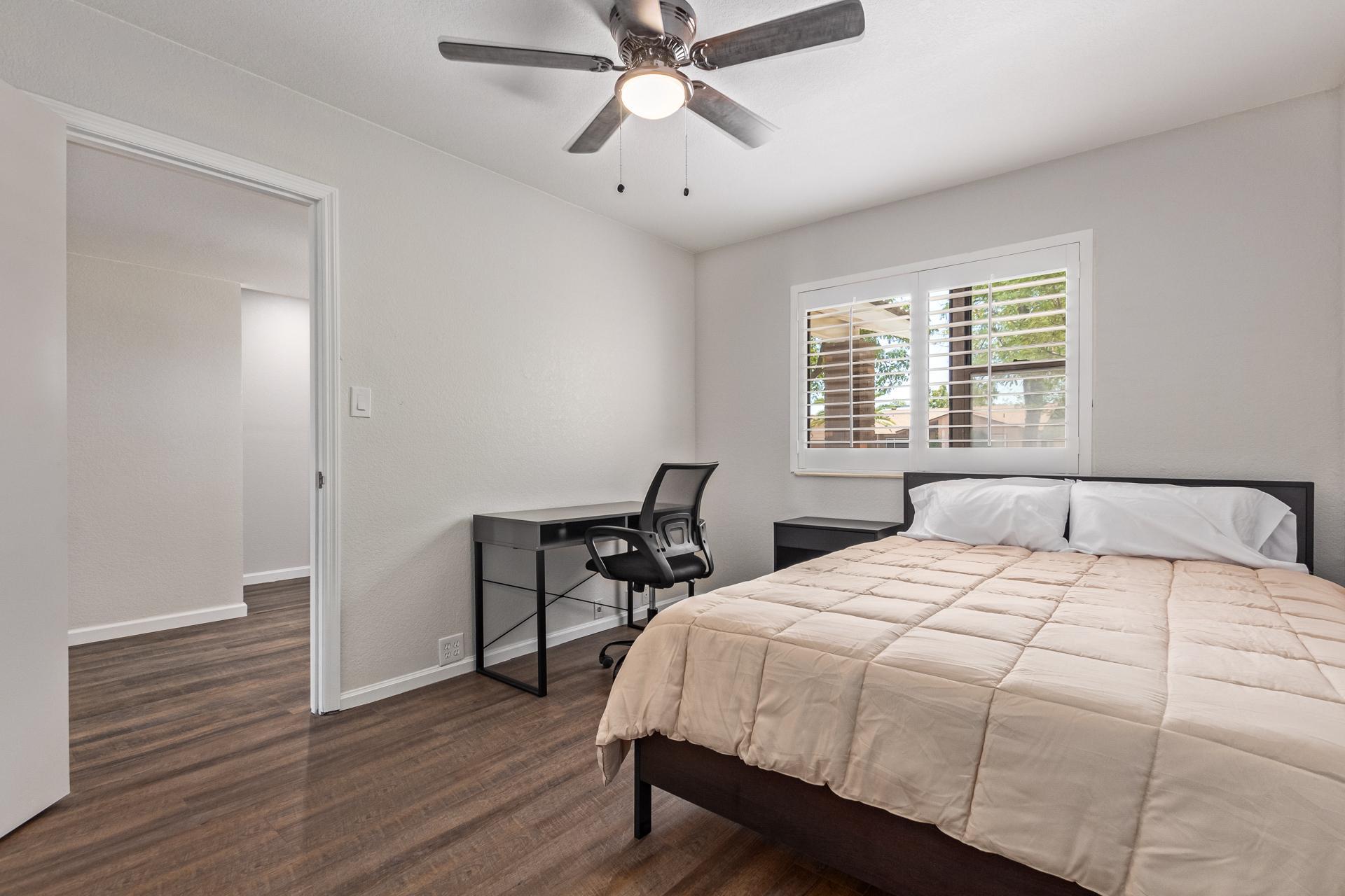Queen size bed. Overlooks front yard.