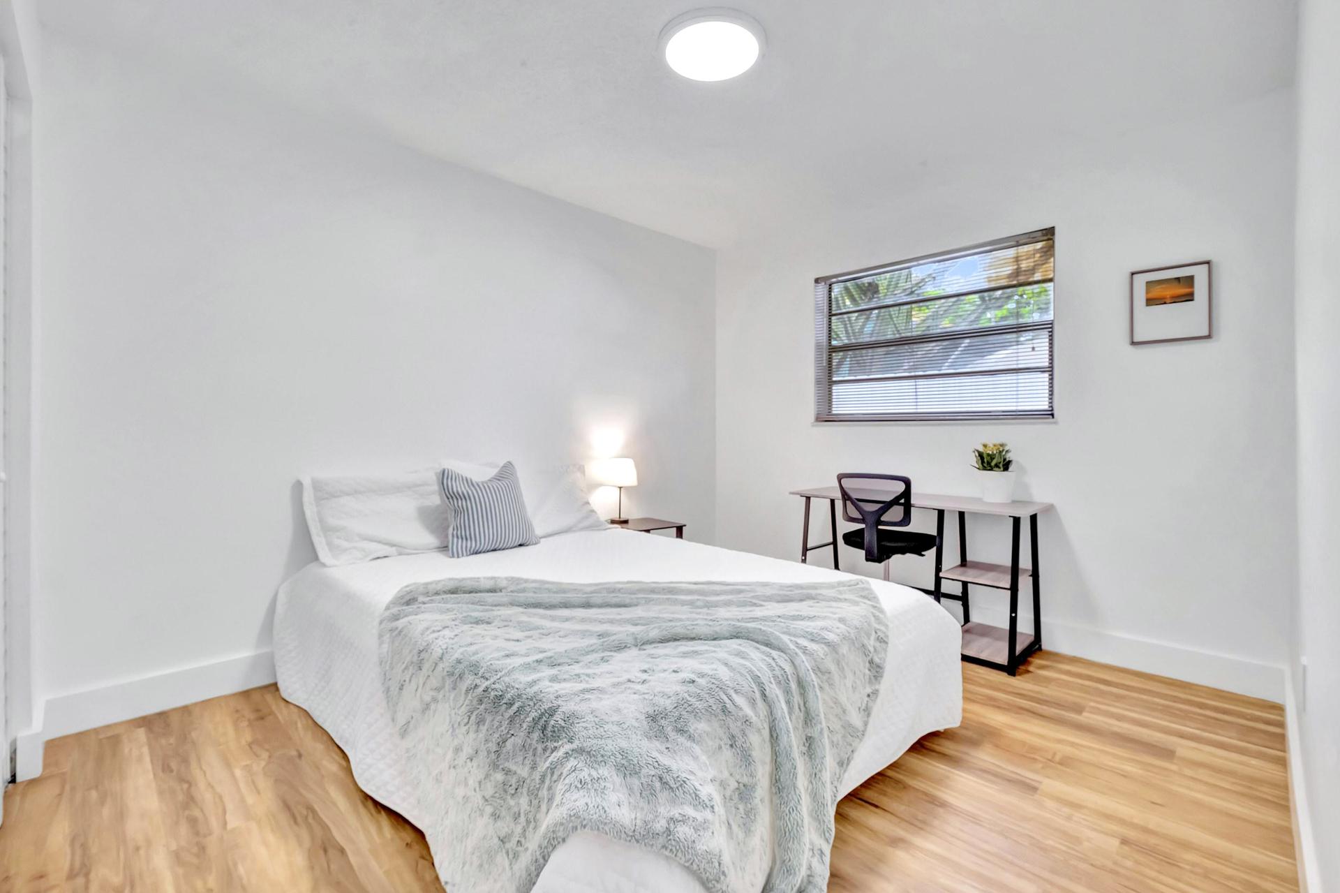 Large room: new memory foam queen size bed with a matress cover. Comes with a night table, lamp, desk and a chair.