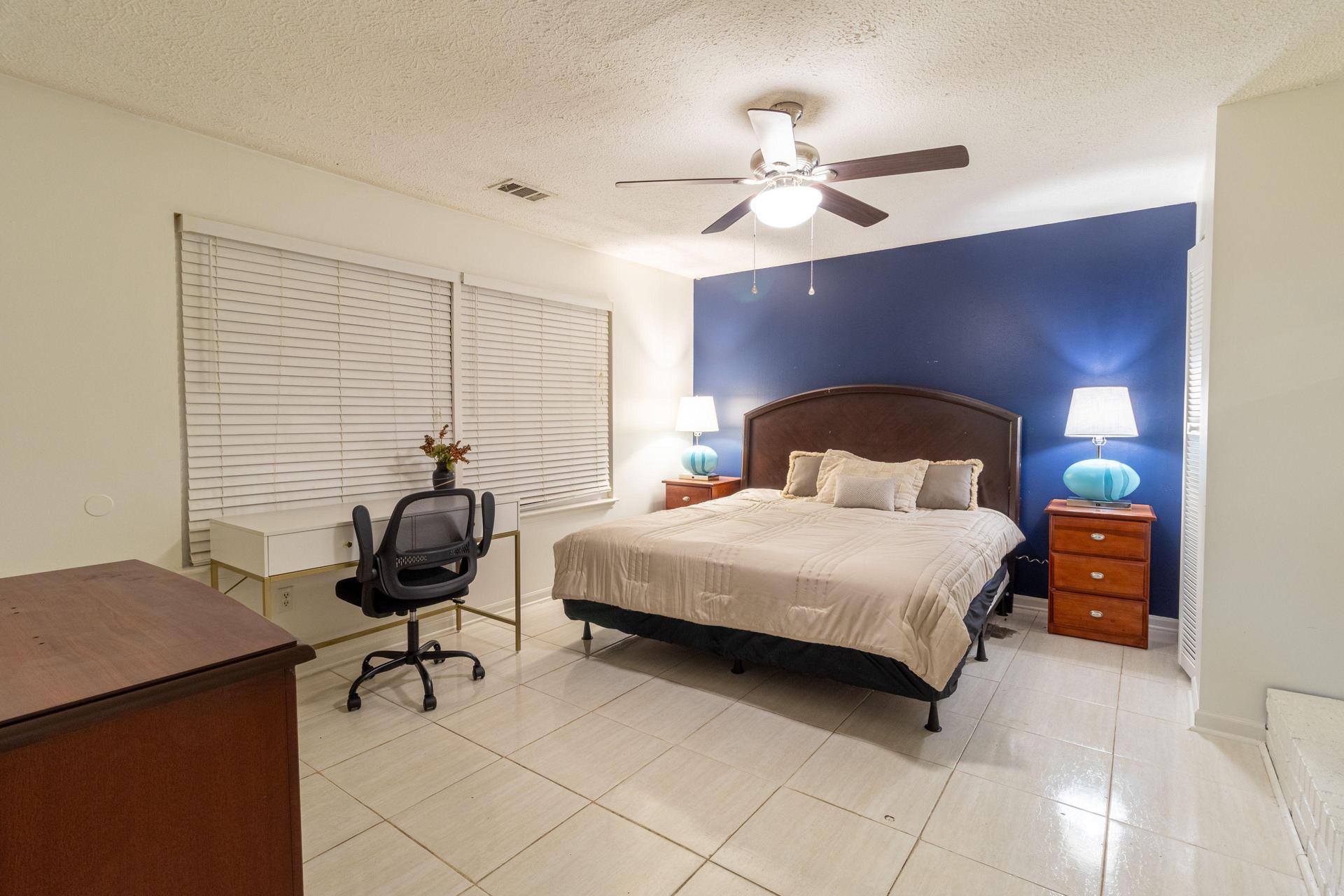 Large room with navy accent wall