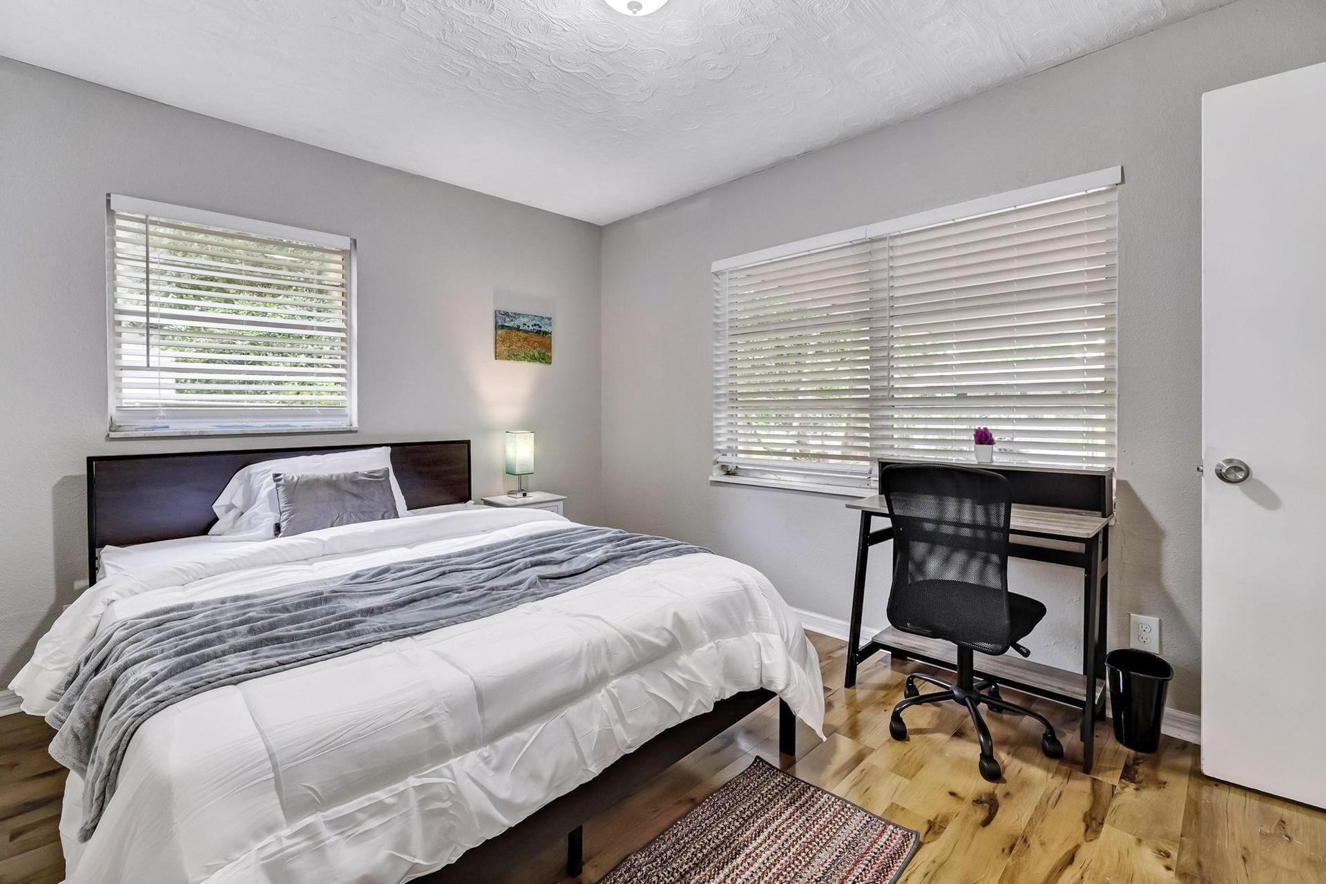 bedroom, detected:window blind, bed, ceiling fan