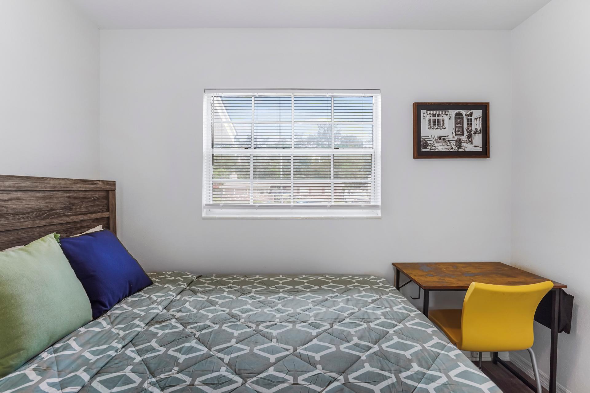 bedroom, detected:window blind, bed, carpet