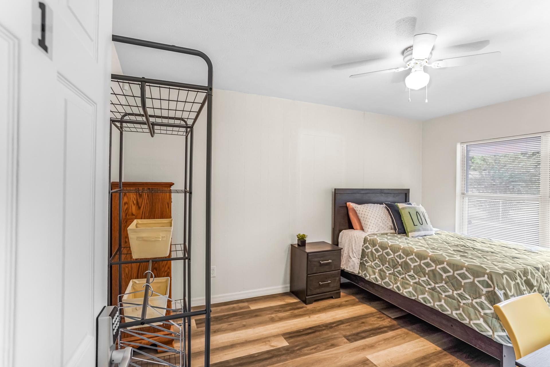 Large spacious bedroom with wide walk space