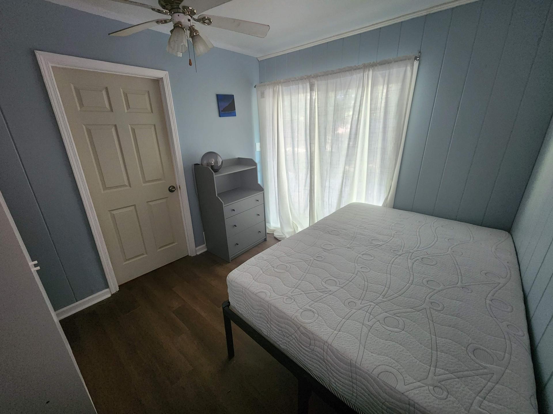 Full size bed, wardrobe and private entry to