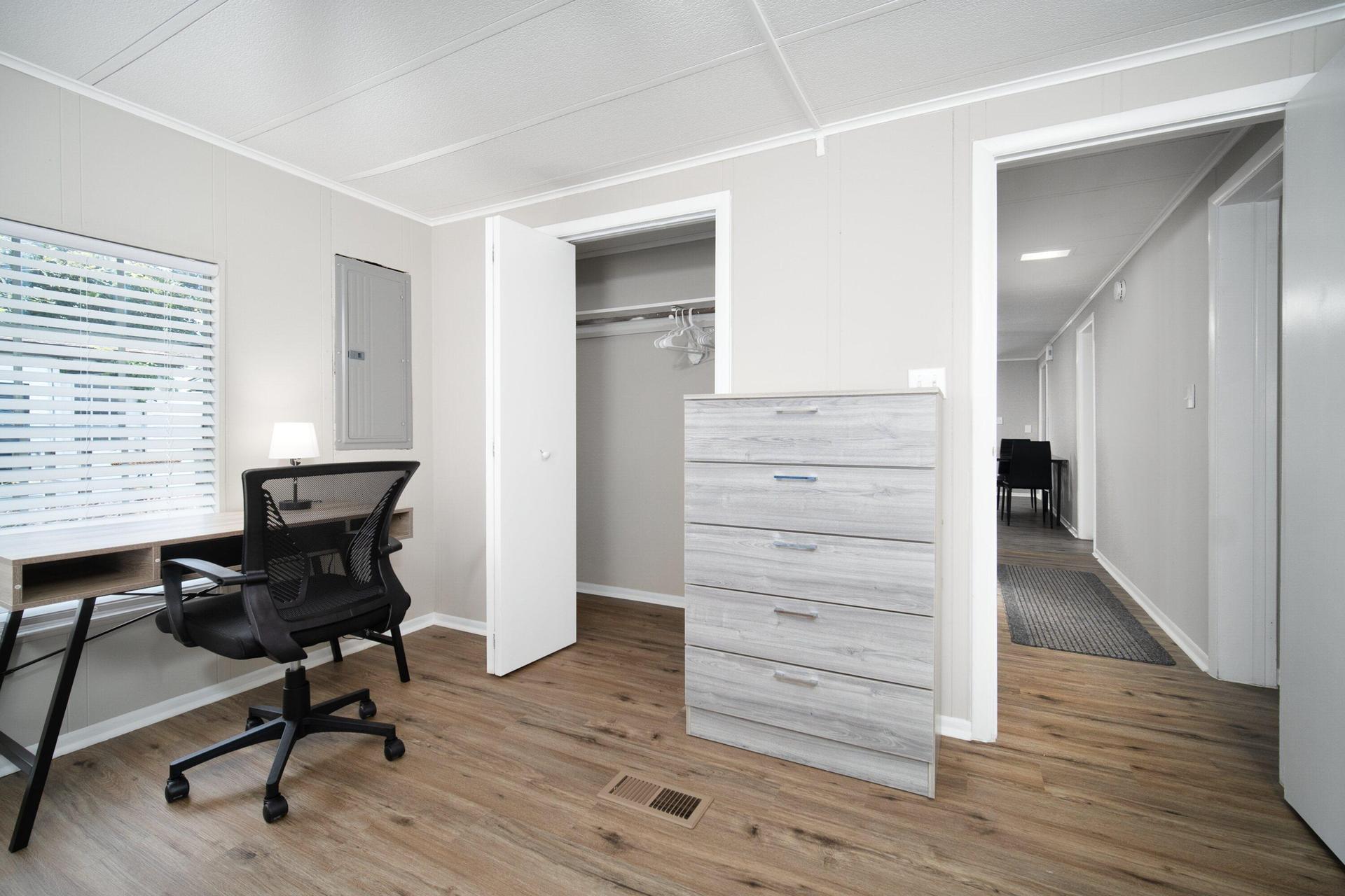 Queen size bed, with desk, chair, full closet, 2 dressers, nightstand and lamp