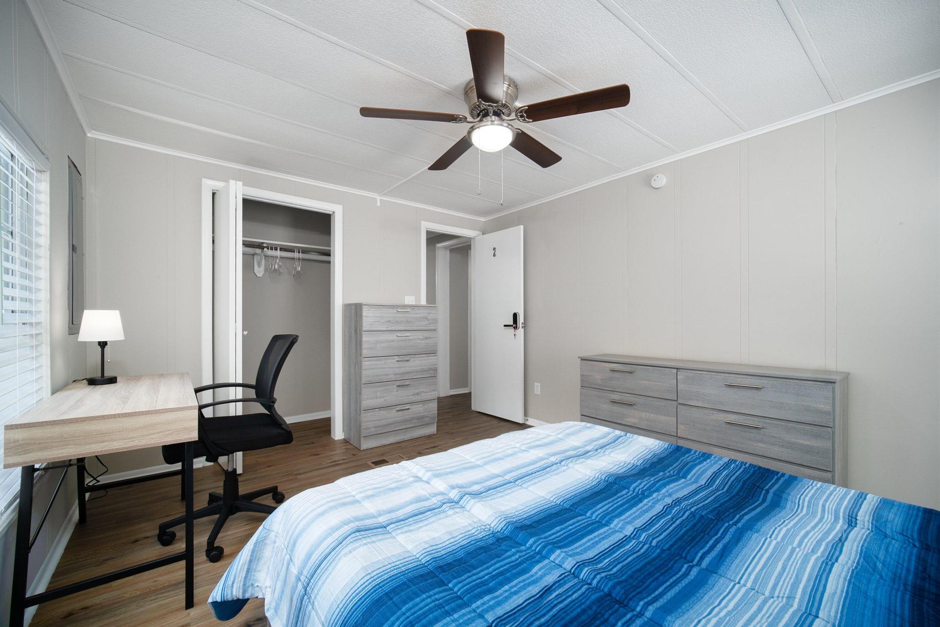 Queen size bed, with desk, chair, full closet, 2 dressers, nightstand and lamp