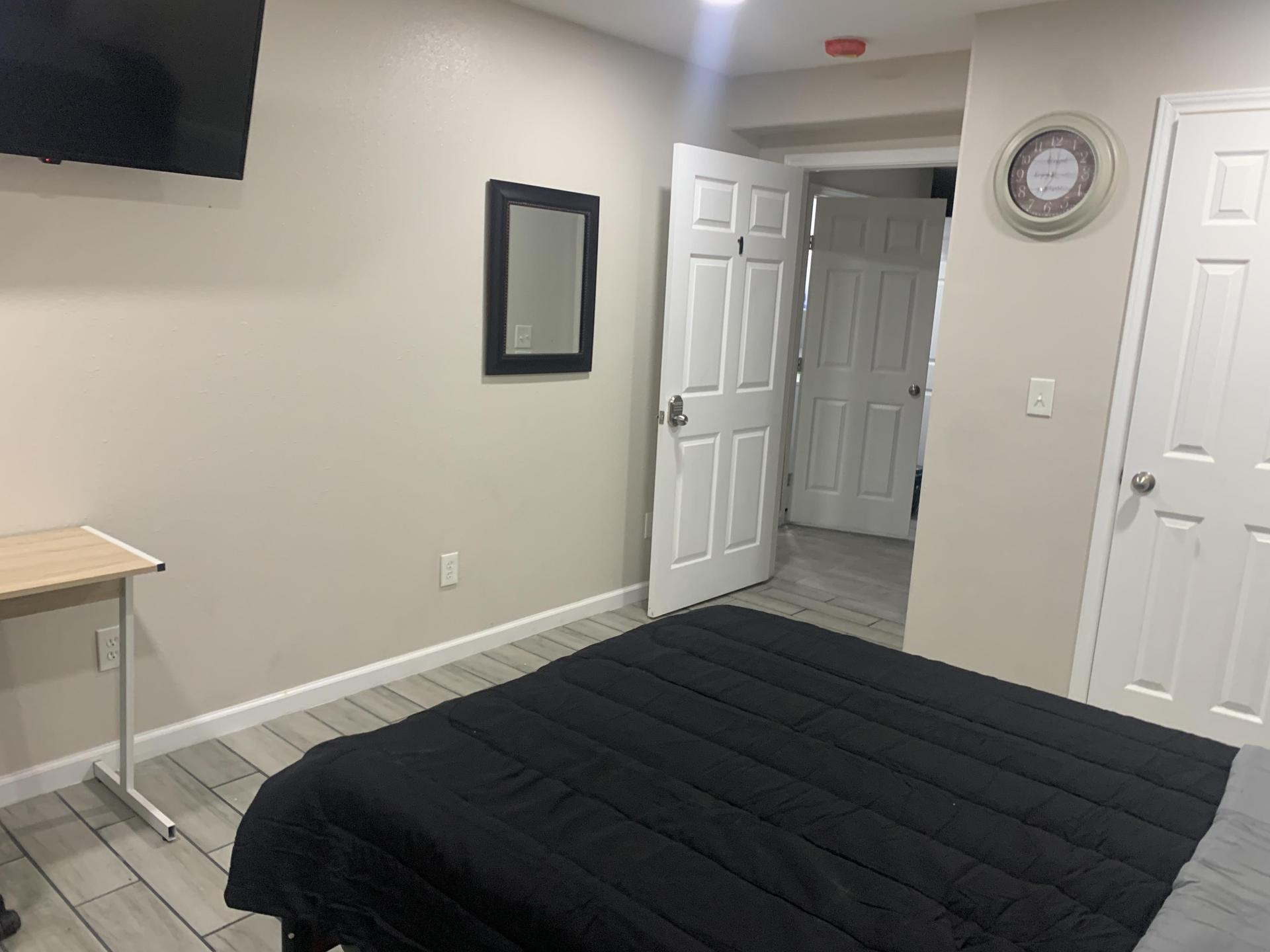 Spacious Bedroom with full size bed, ceiling fan, 42" TV and work space.
