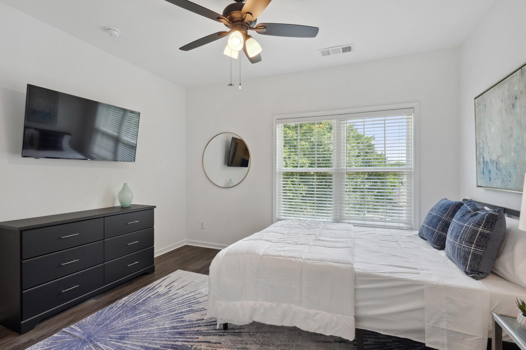 Another View of the Room with Large Dresser and Large TV