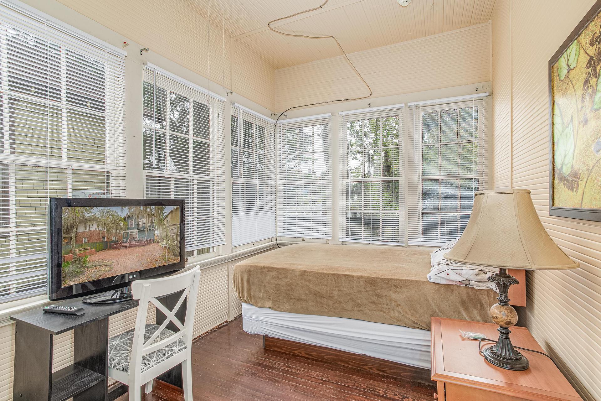 Wall to wall windows in this room. Plush mattress full size bed