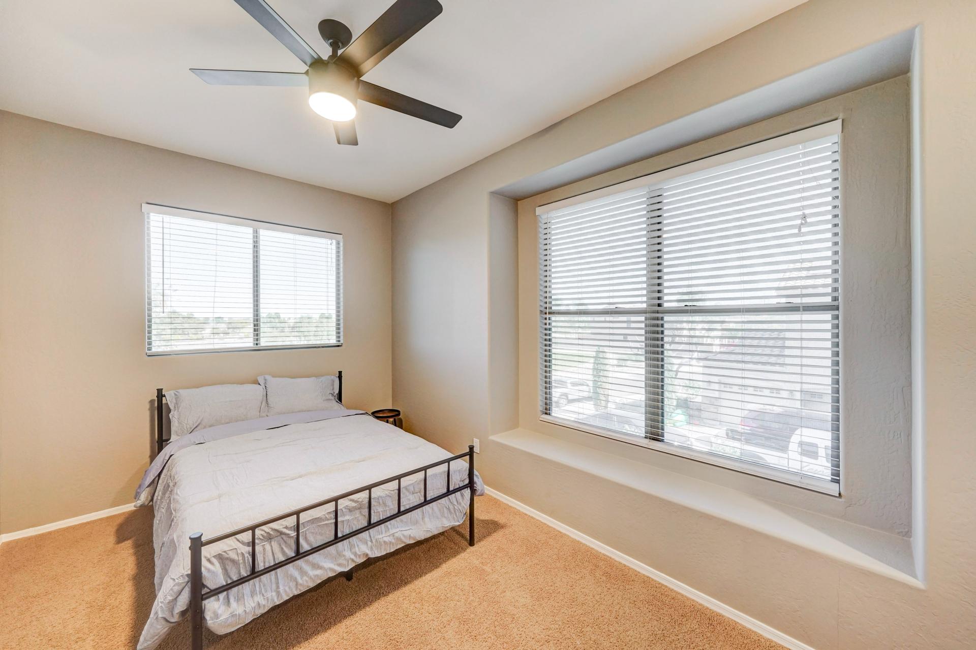 bedroom, detected:window blind, ceiling fan, bed