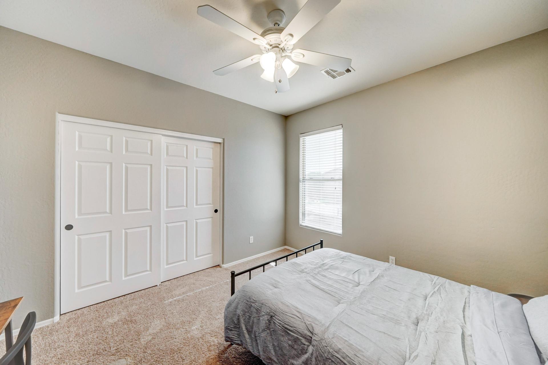 bedroom, detected:ceiling fan, window blind, bed