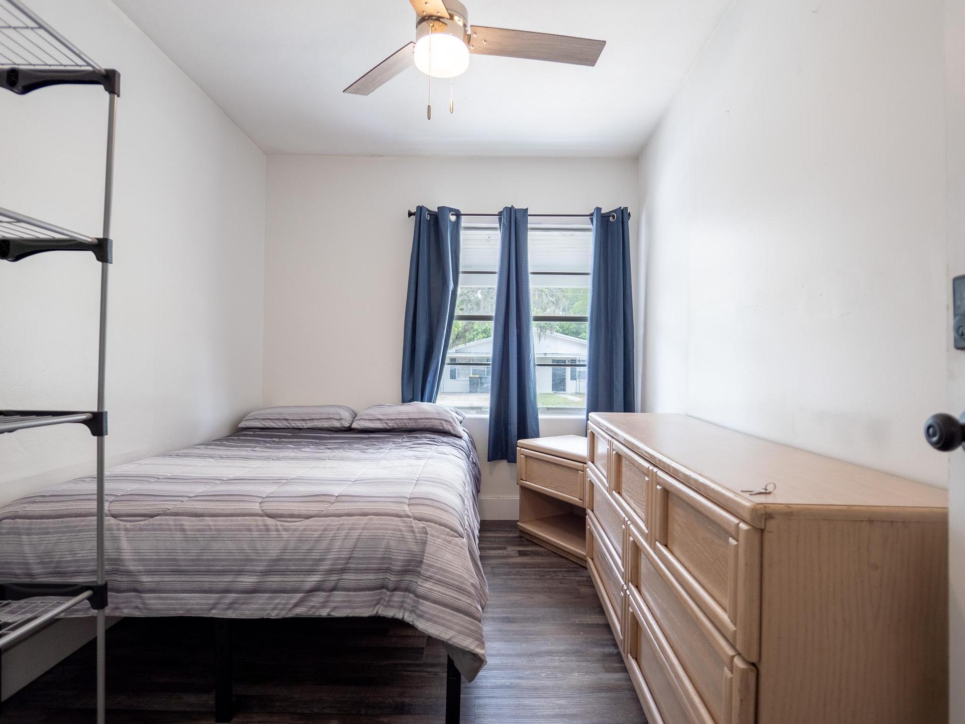 Equipped with a dresser and a nightstand