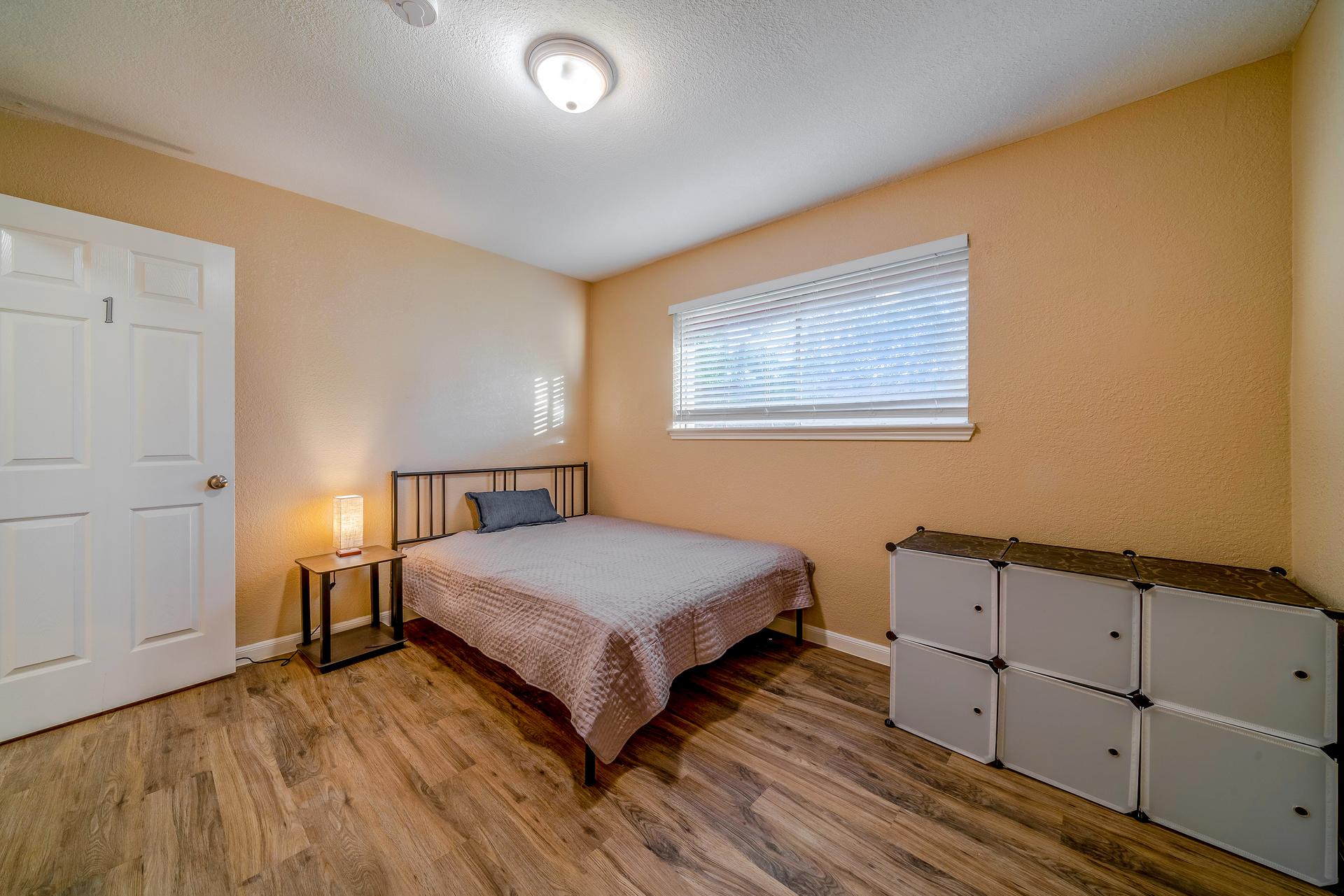 bedroom, detected: hardwood, window blind, bed