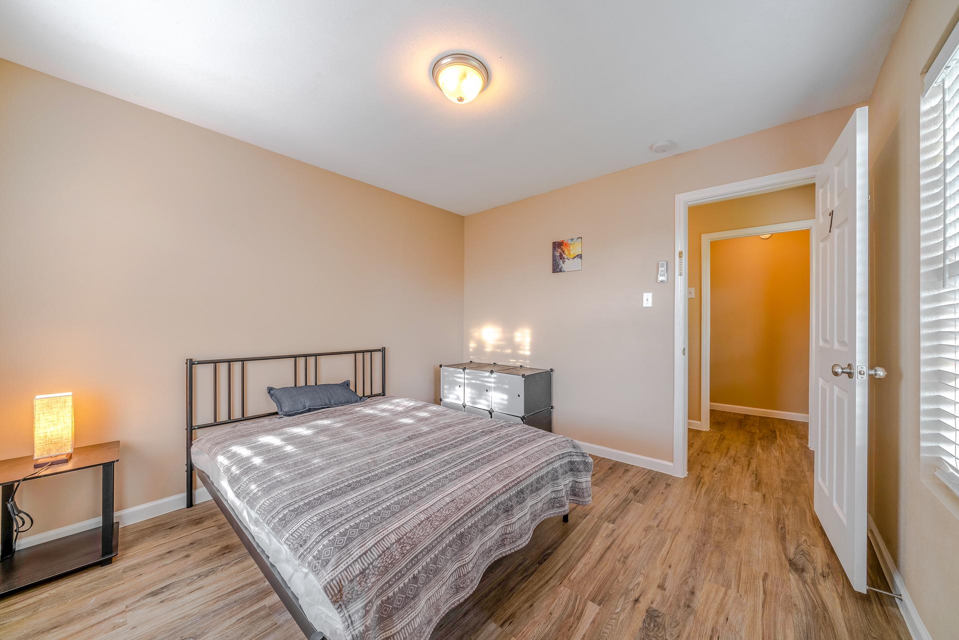 bedroom, detected: hardwood, window blind, bed