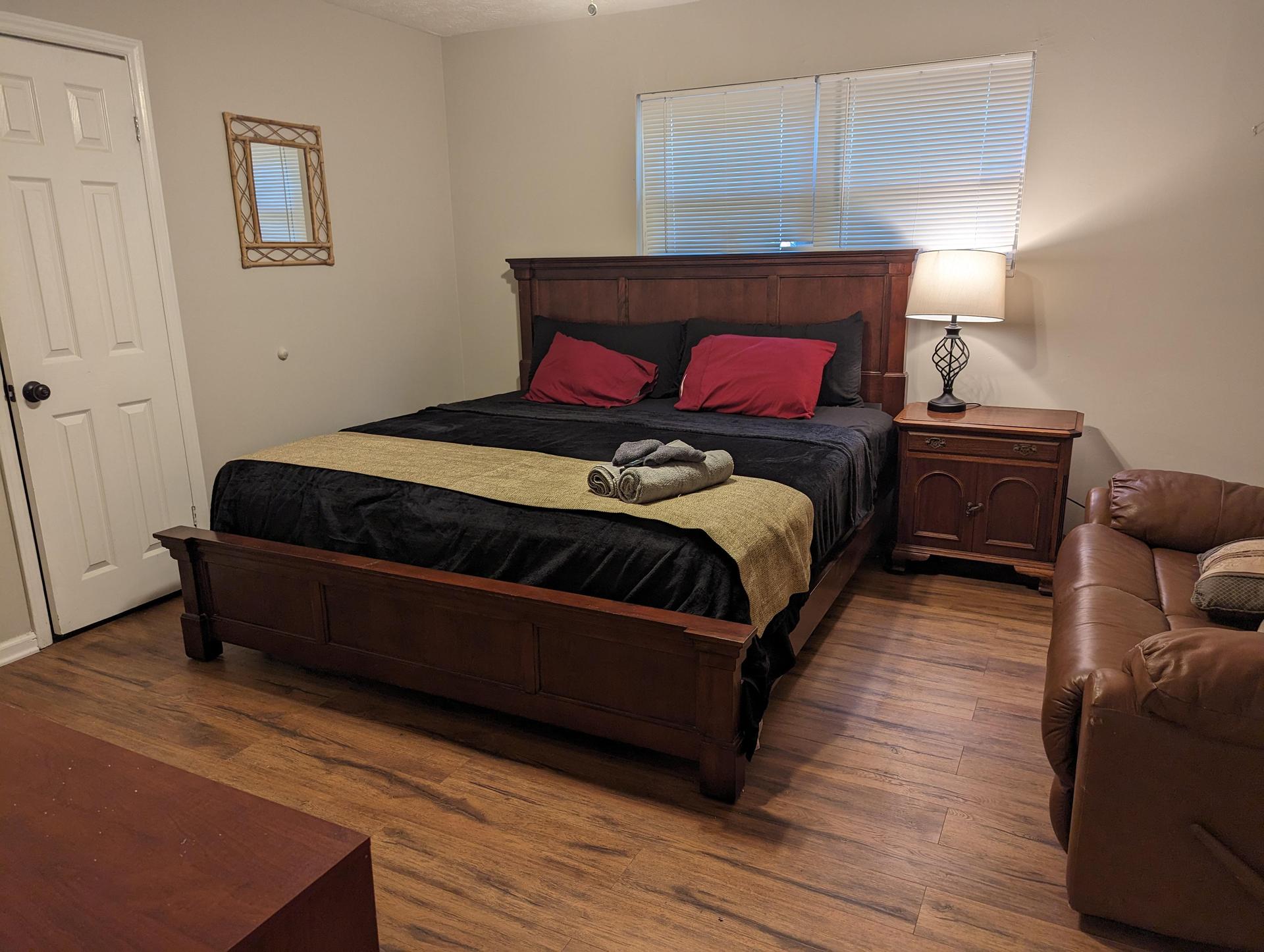 King bed with closet and large window
