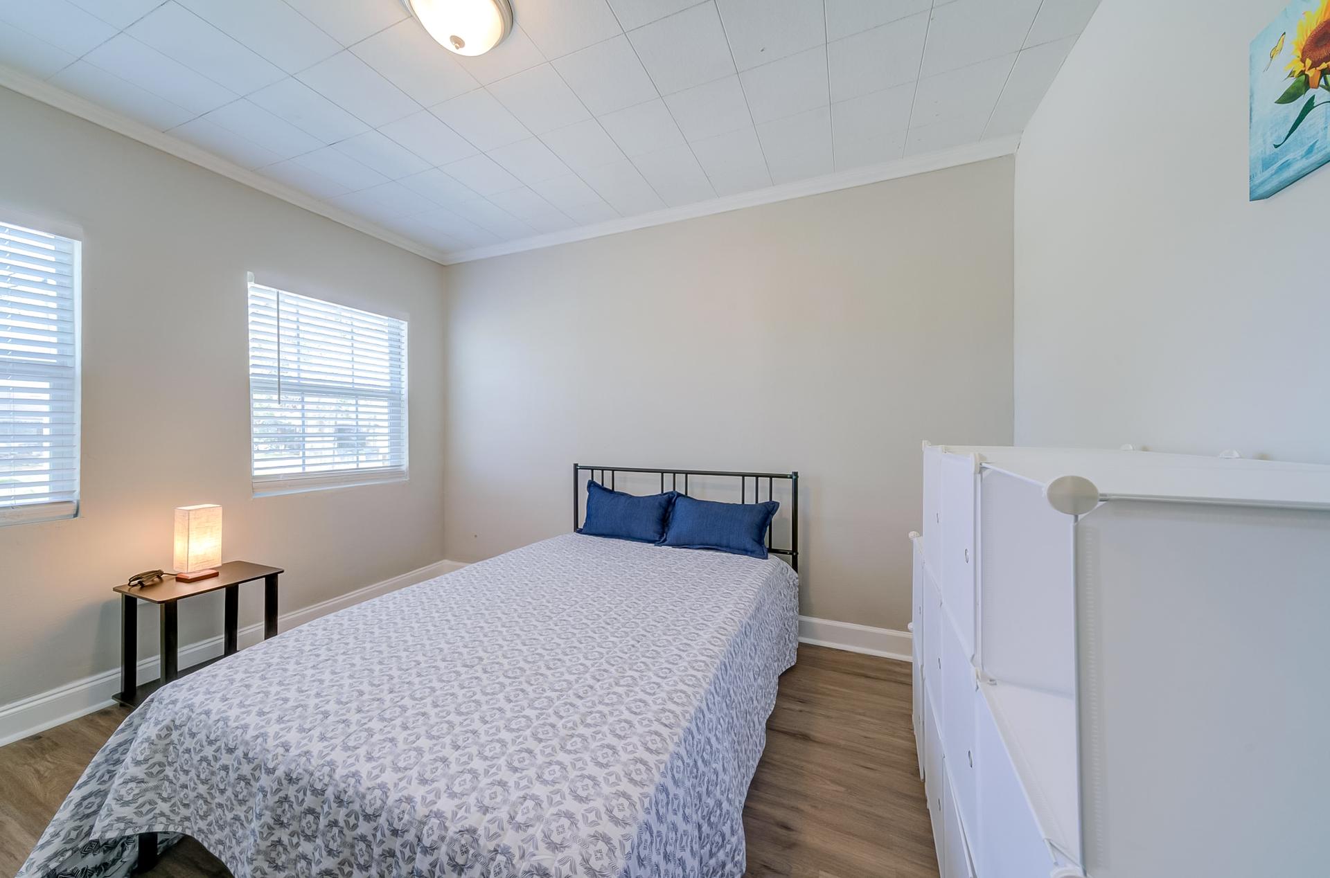 bedroom, detected: hardwood, window blind, bed