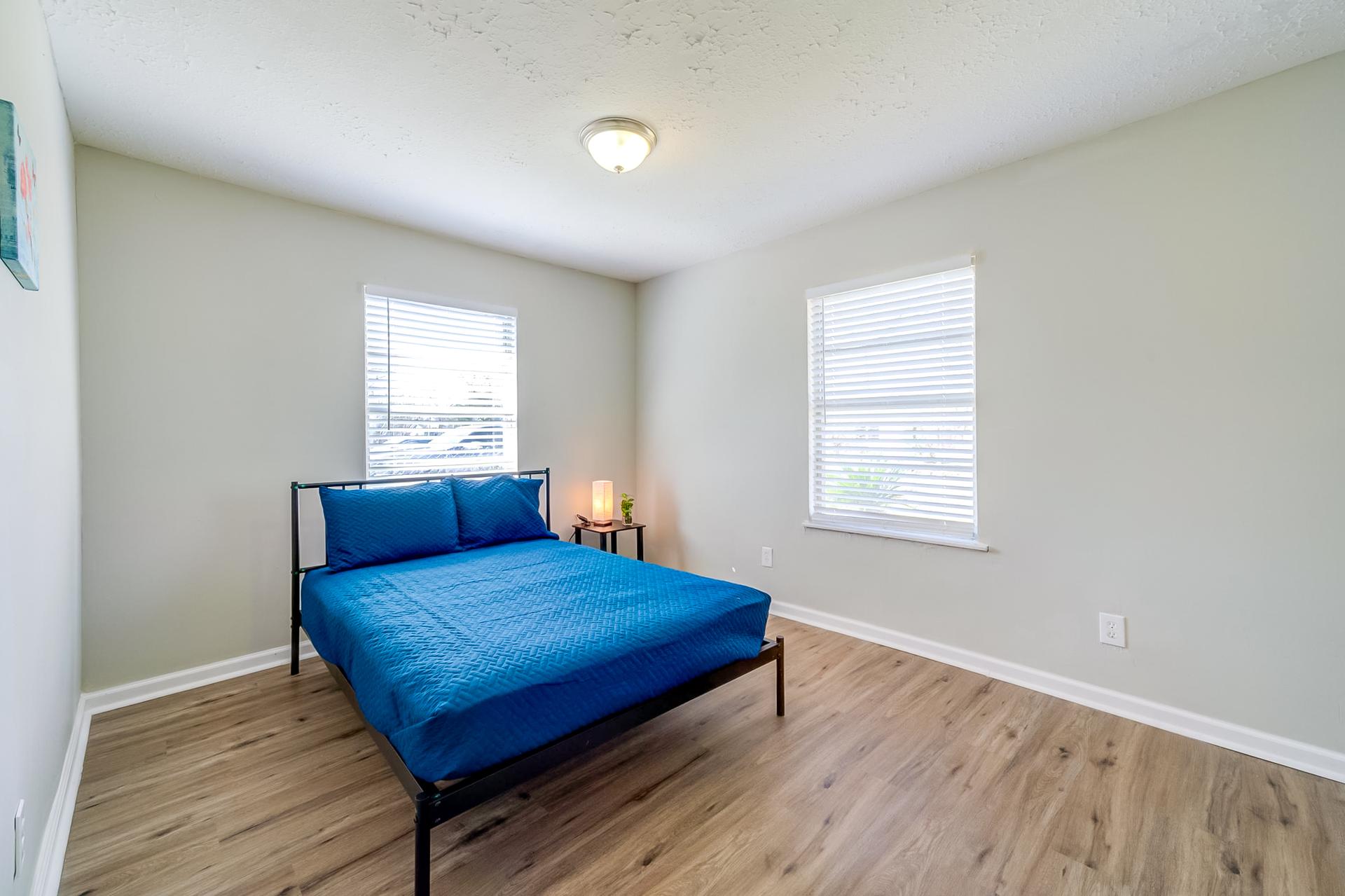bedroom, detected: hardwood, window blind, bed