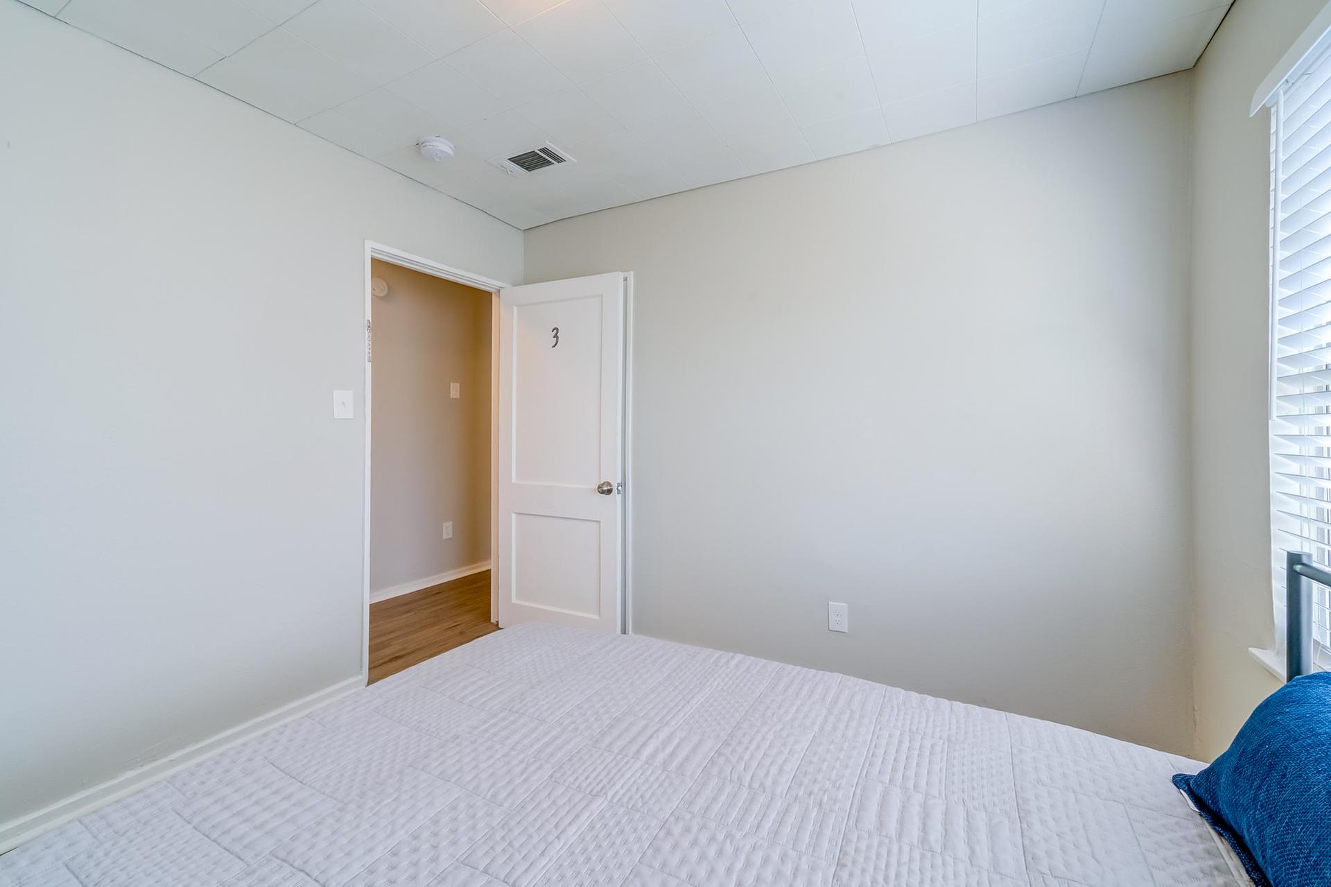 bedroom, detected: hardwood, window blind, bed