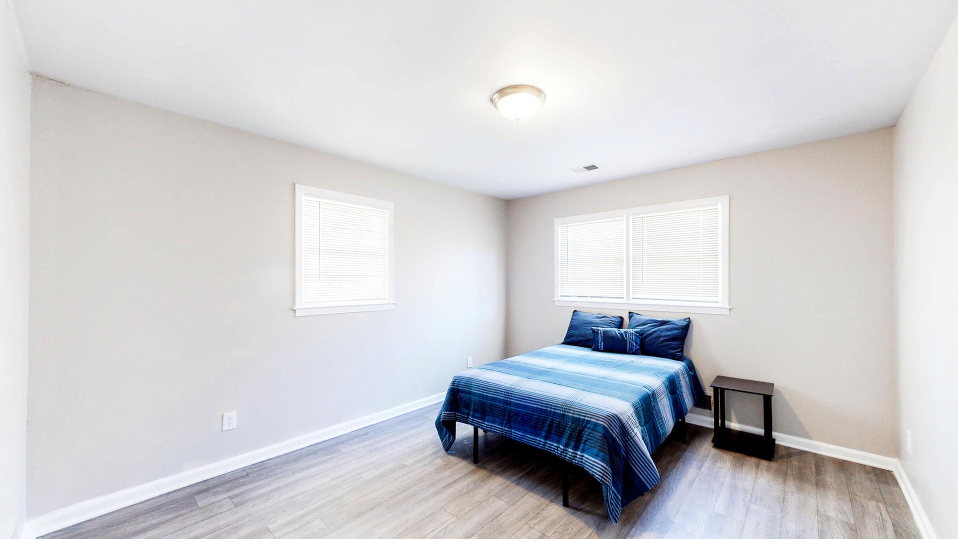 Large-sized upper level bedroom.