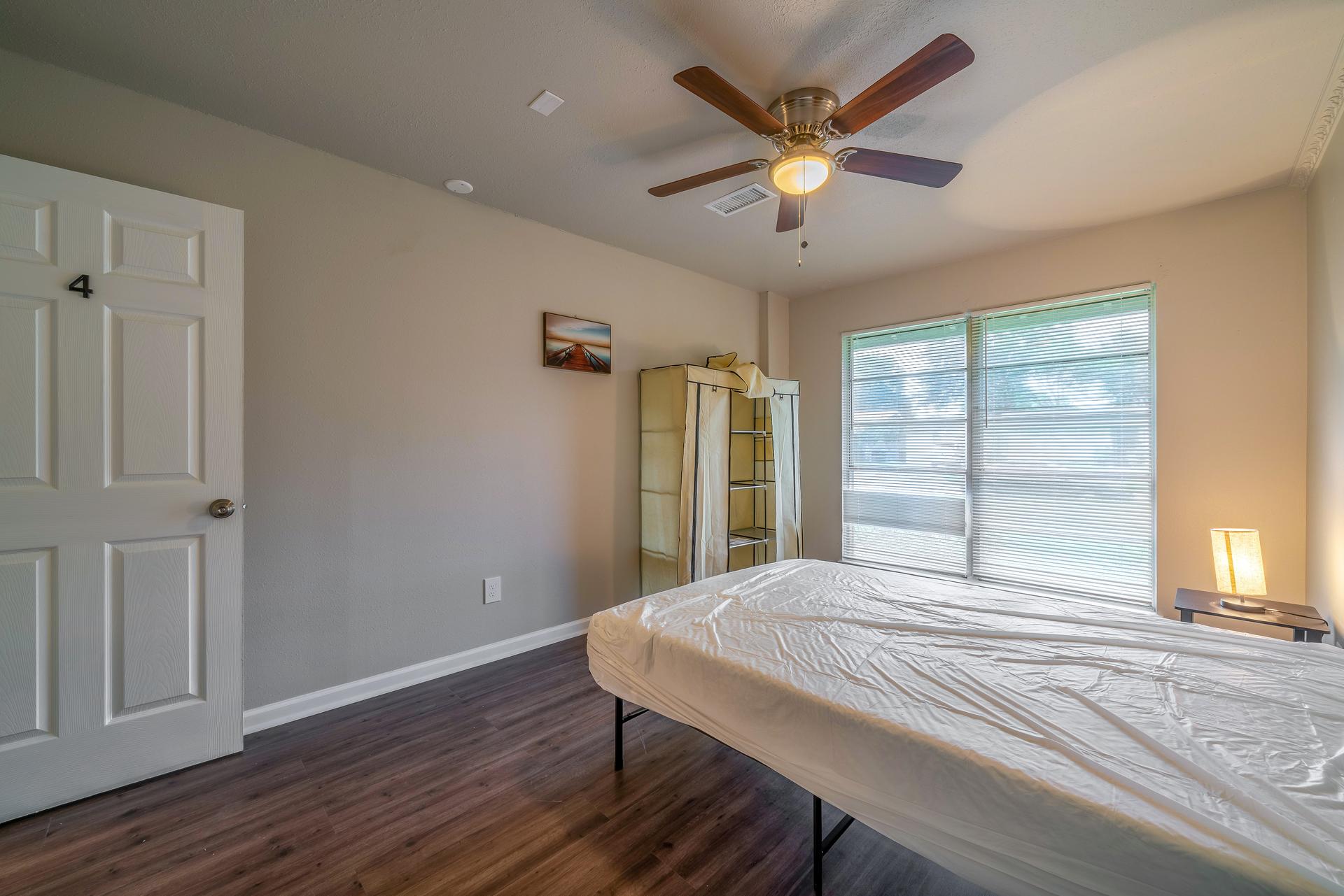 bedroom, detected: ceiling fan, window blind, bed