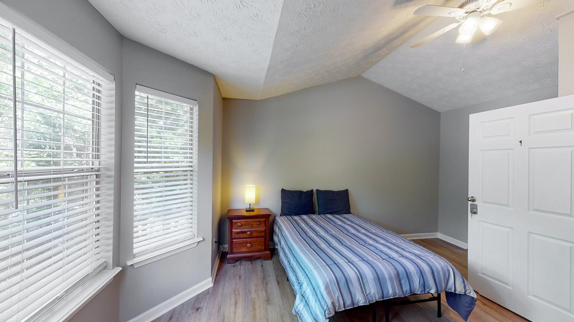 bedroom, detected: bed, window blind, ceiling fan