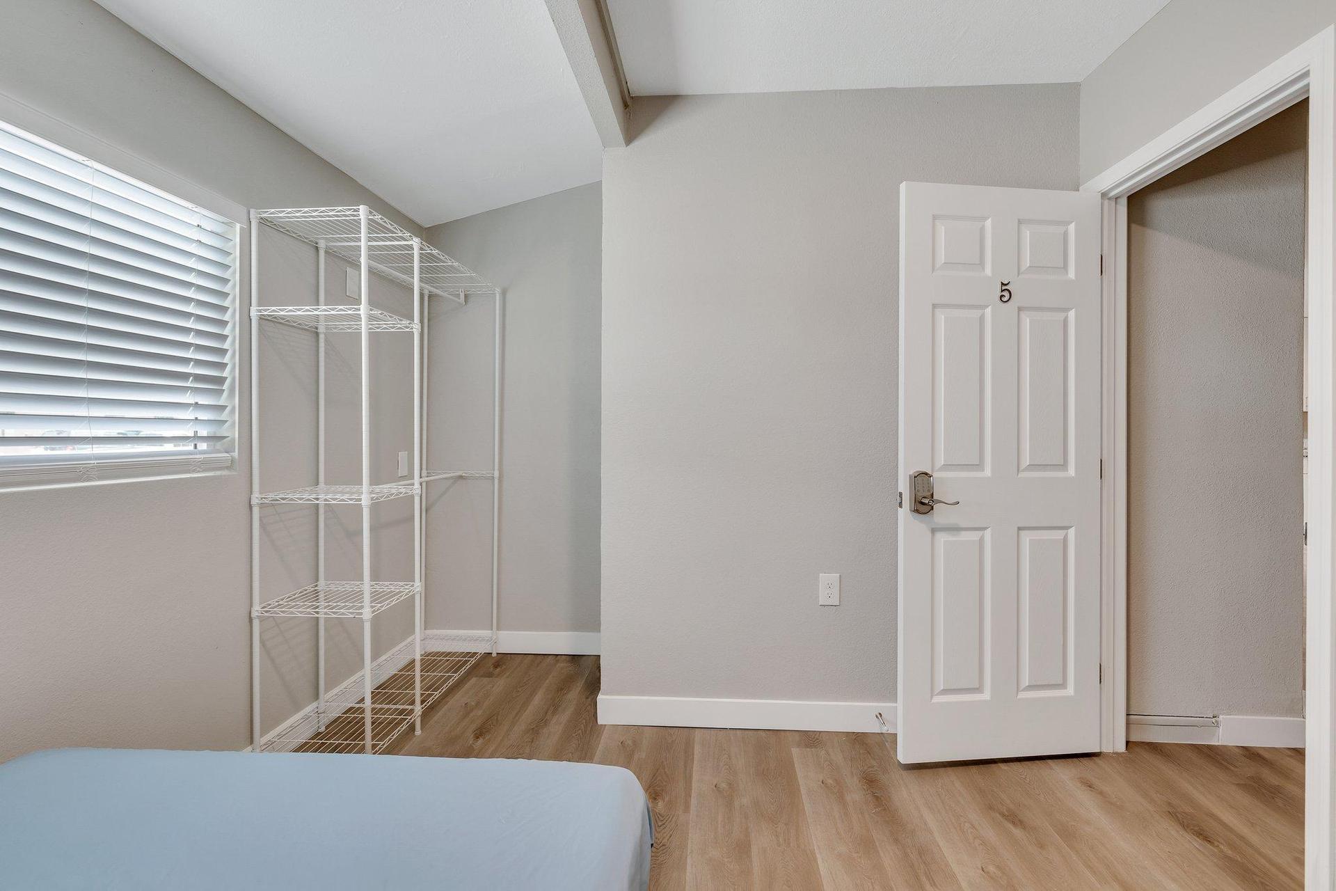 Room 5, wardrobe, looking out to hallway