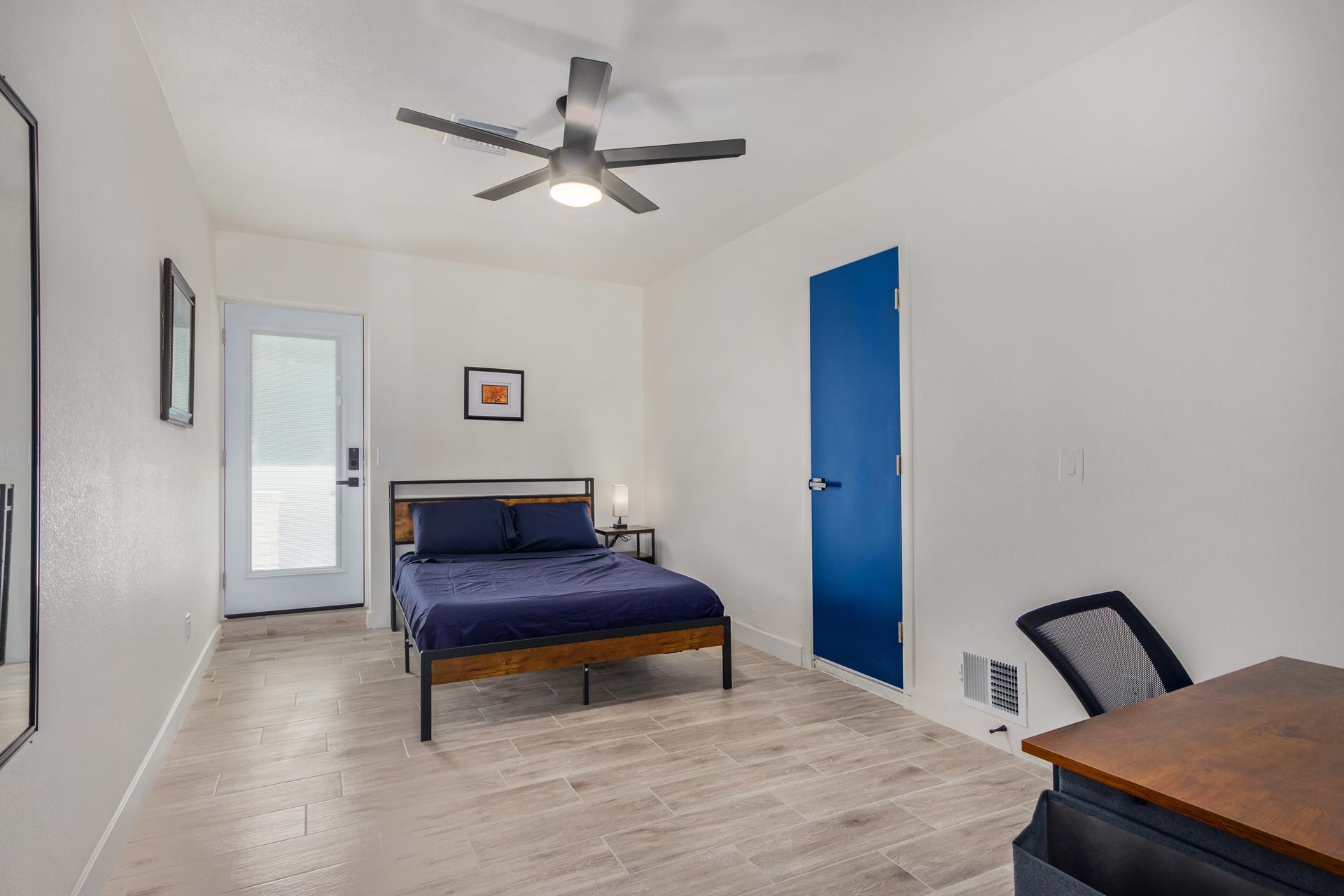 Awesome private door-access to the driveway with  a digital lock. Enjoy a large closet with shelves and workspace corner.