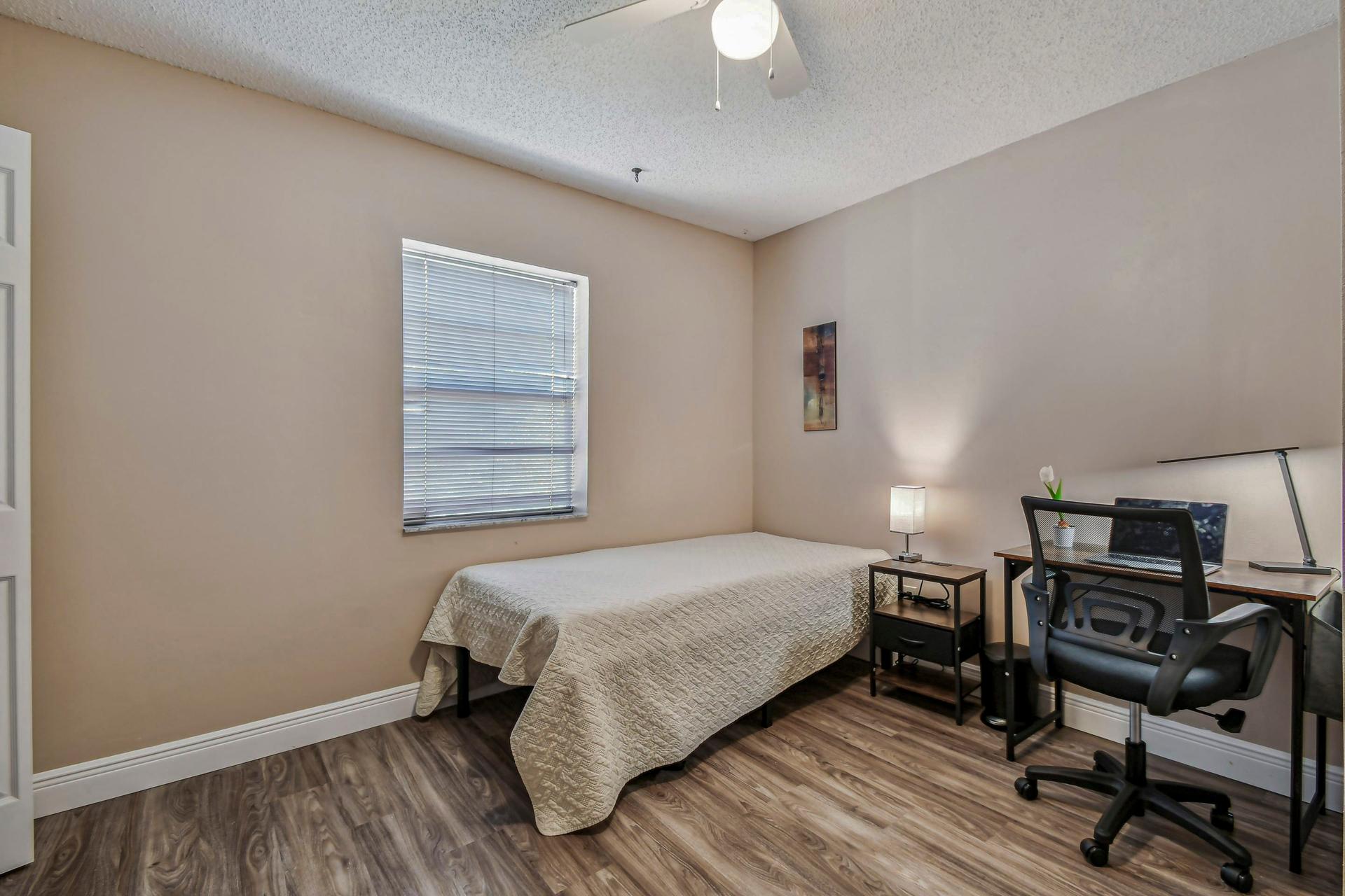 bedroom, detected:window blind, bed, ceiling fan