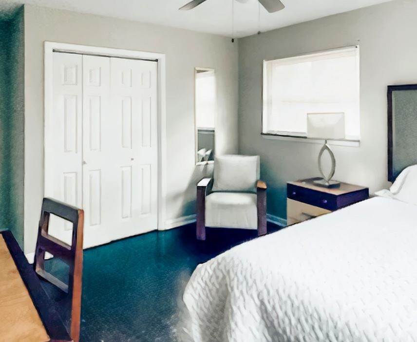 This room also has a large closet and a full-length mirror.