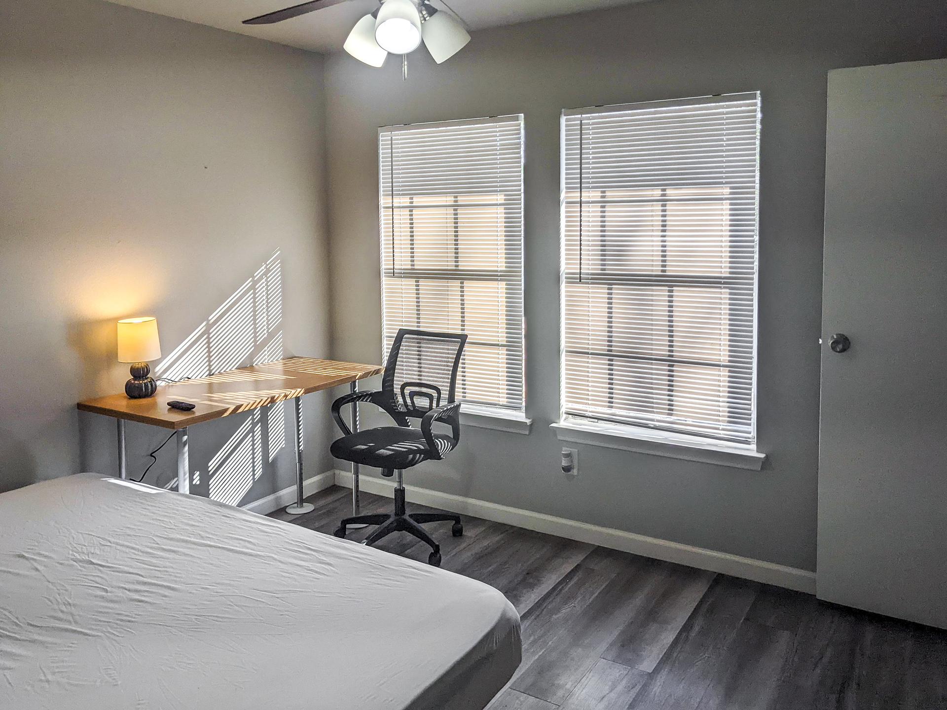 living_room, detected: window blind, ceiling fan, bed