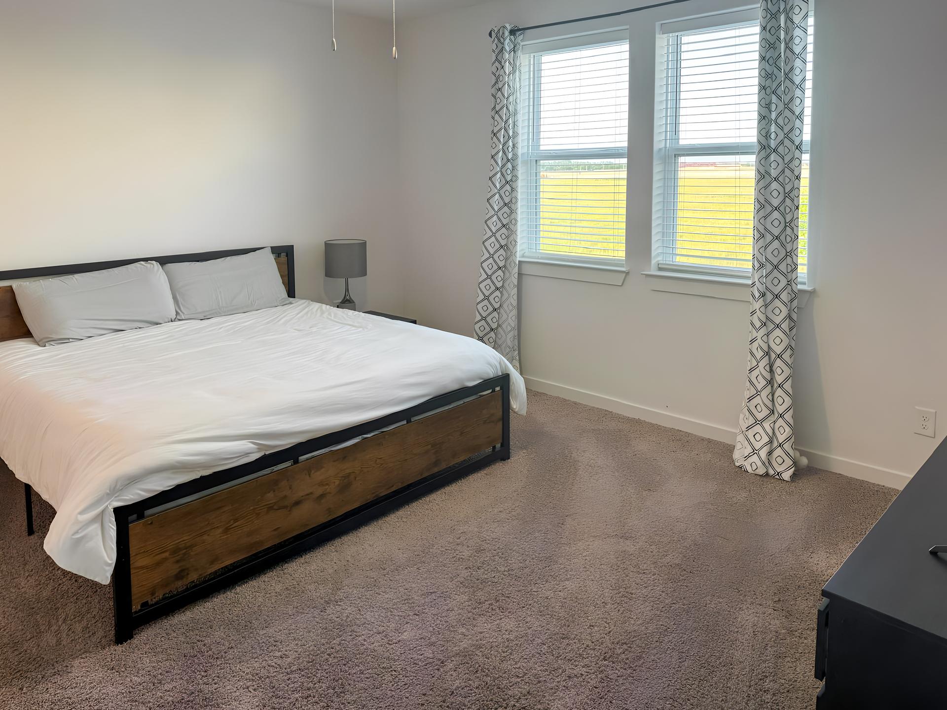 bedroom, detected:window blind, bed, ceiling fan