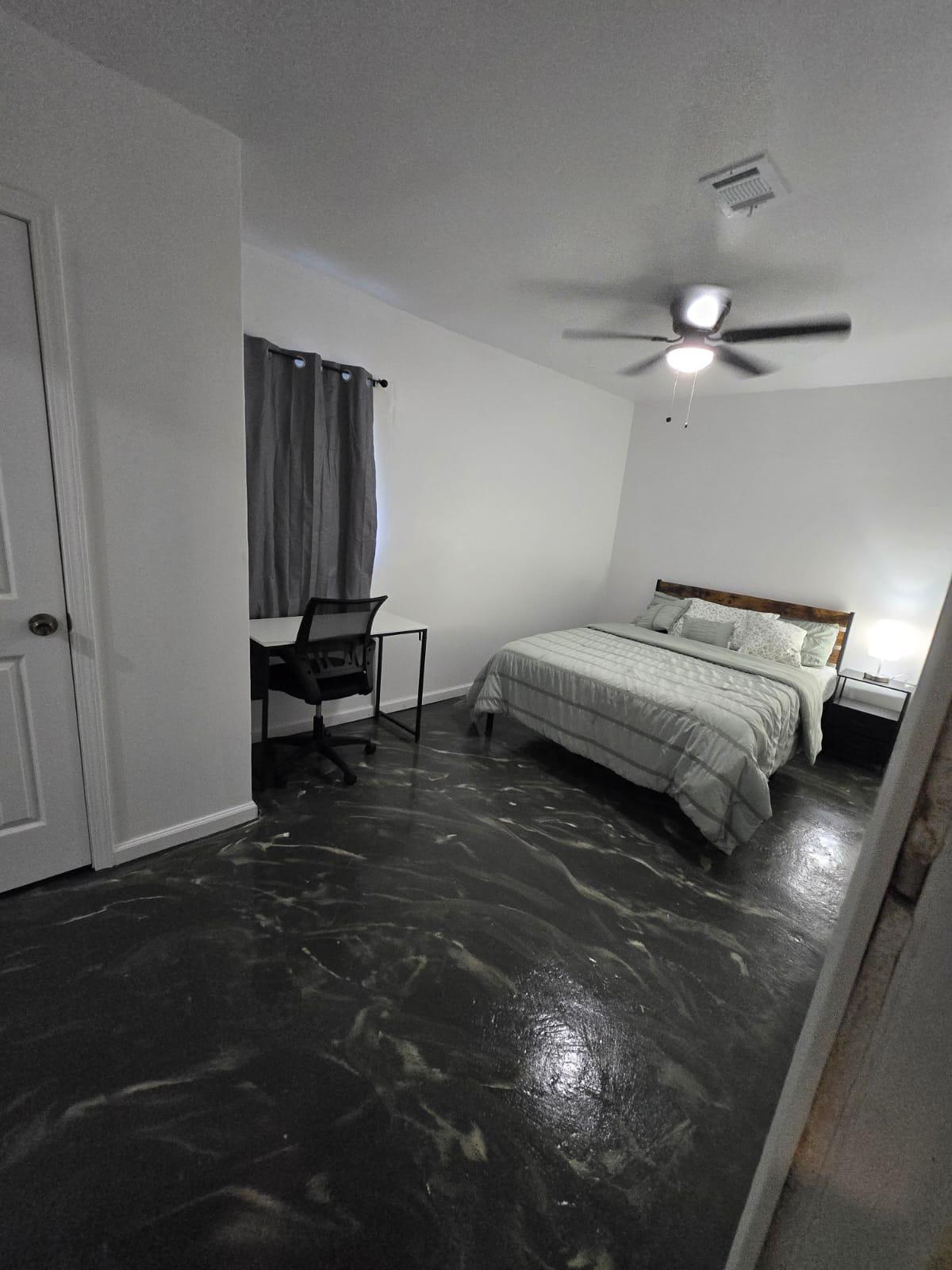 This fresh and cozy room tucked in a quiet corner of the house features a TV and full private bathroom