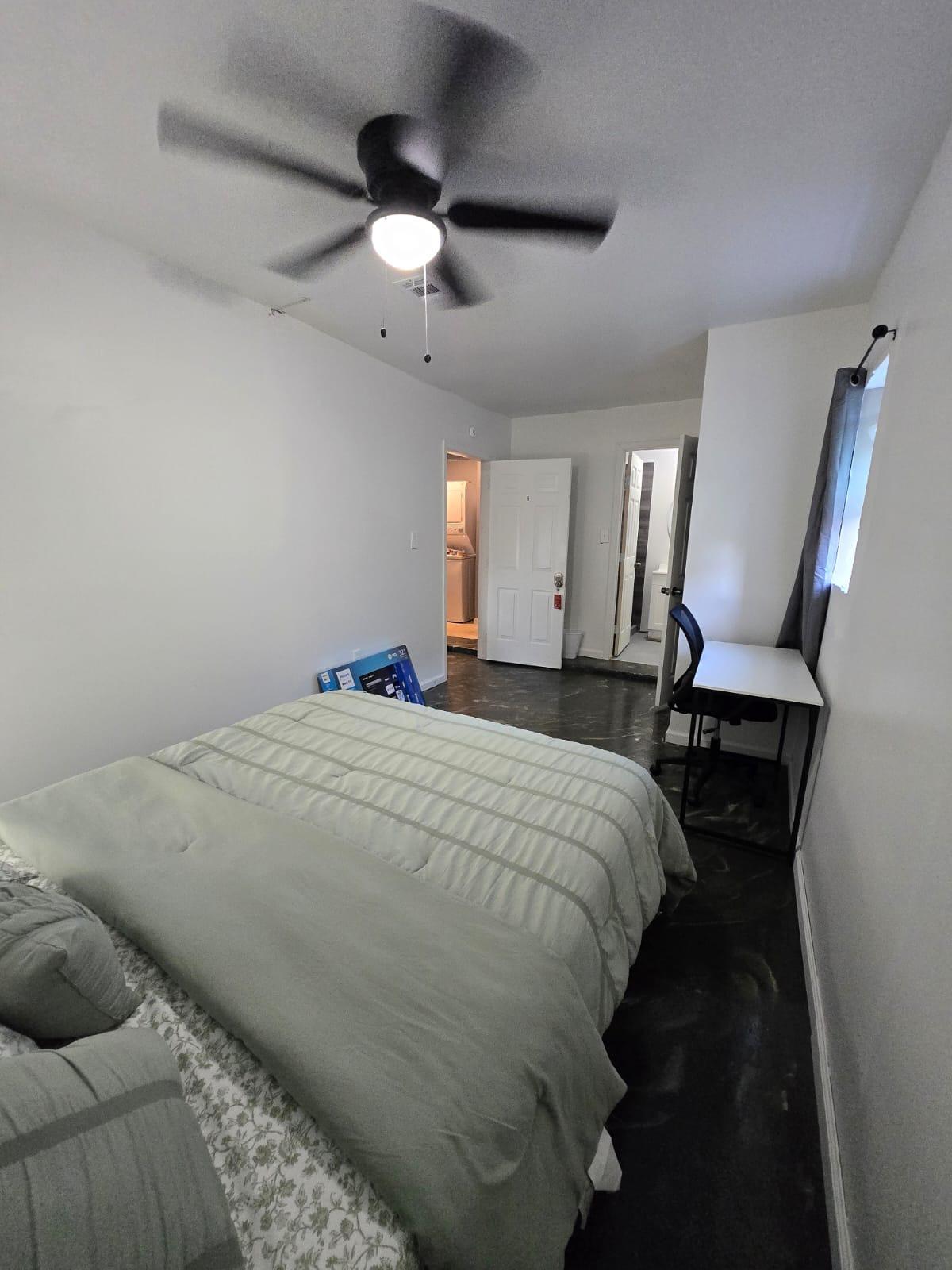 This fresh and cozy room tucked in a quiet corner of the house features a TV and full private bathroom