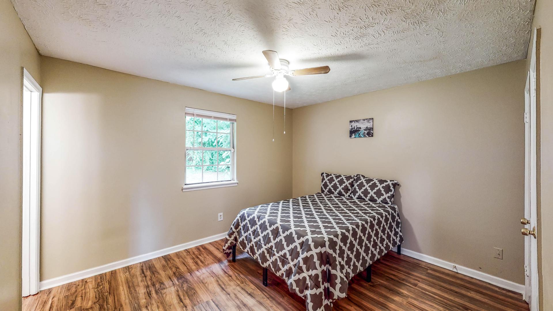 bedroom, detected: window blind, ceiling fan, bed
