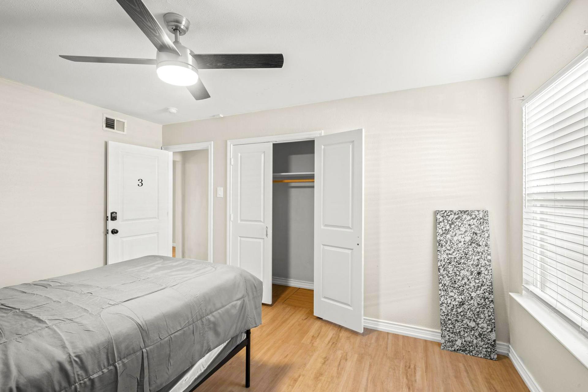 bedroom, detected:window blind, bed, ceiling fan