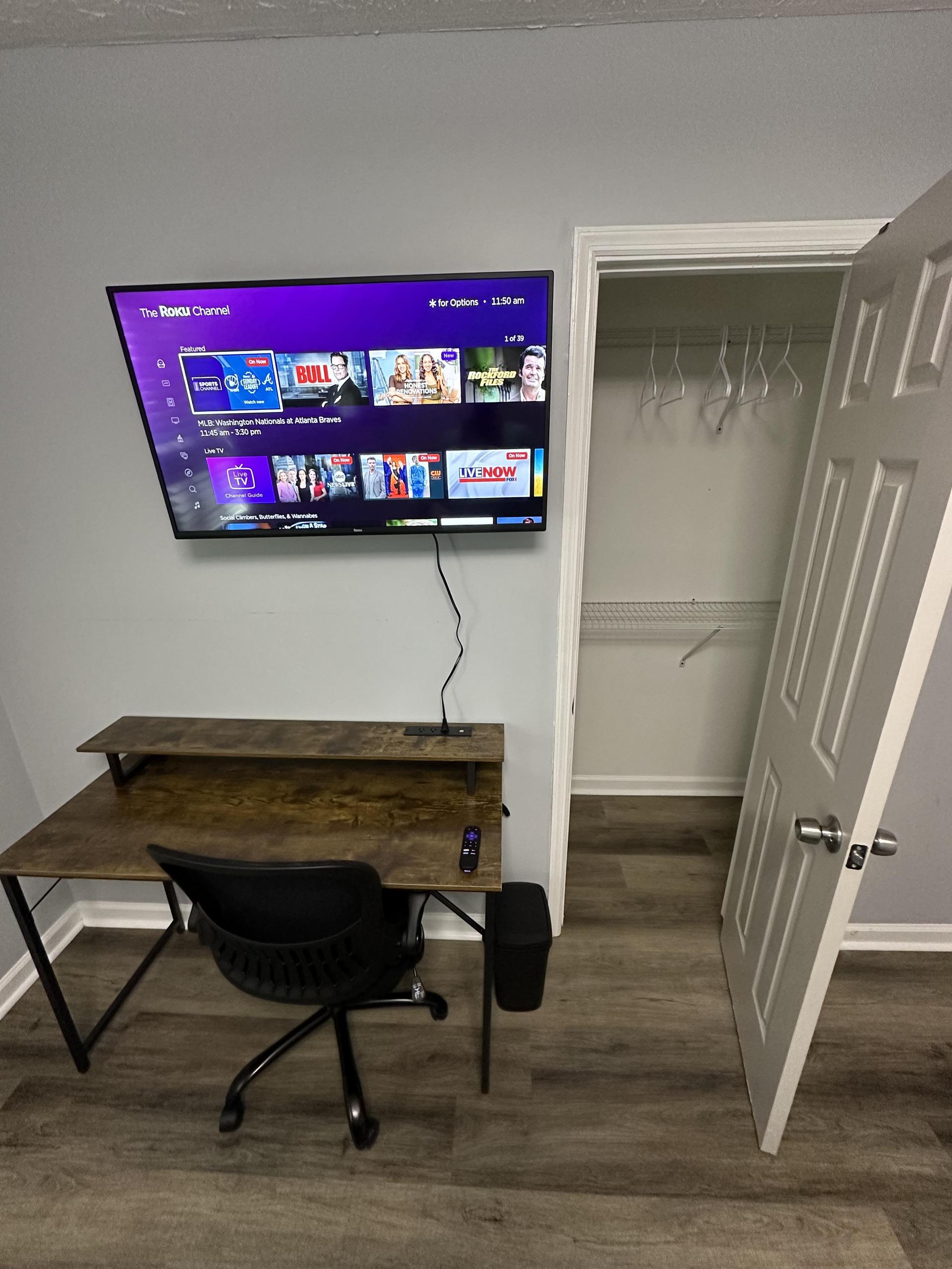 40" Roku with 47" desk and ergonomic roller chair and closet
