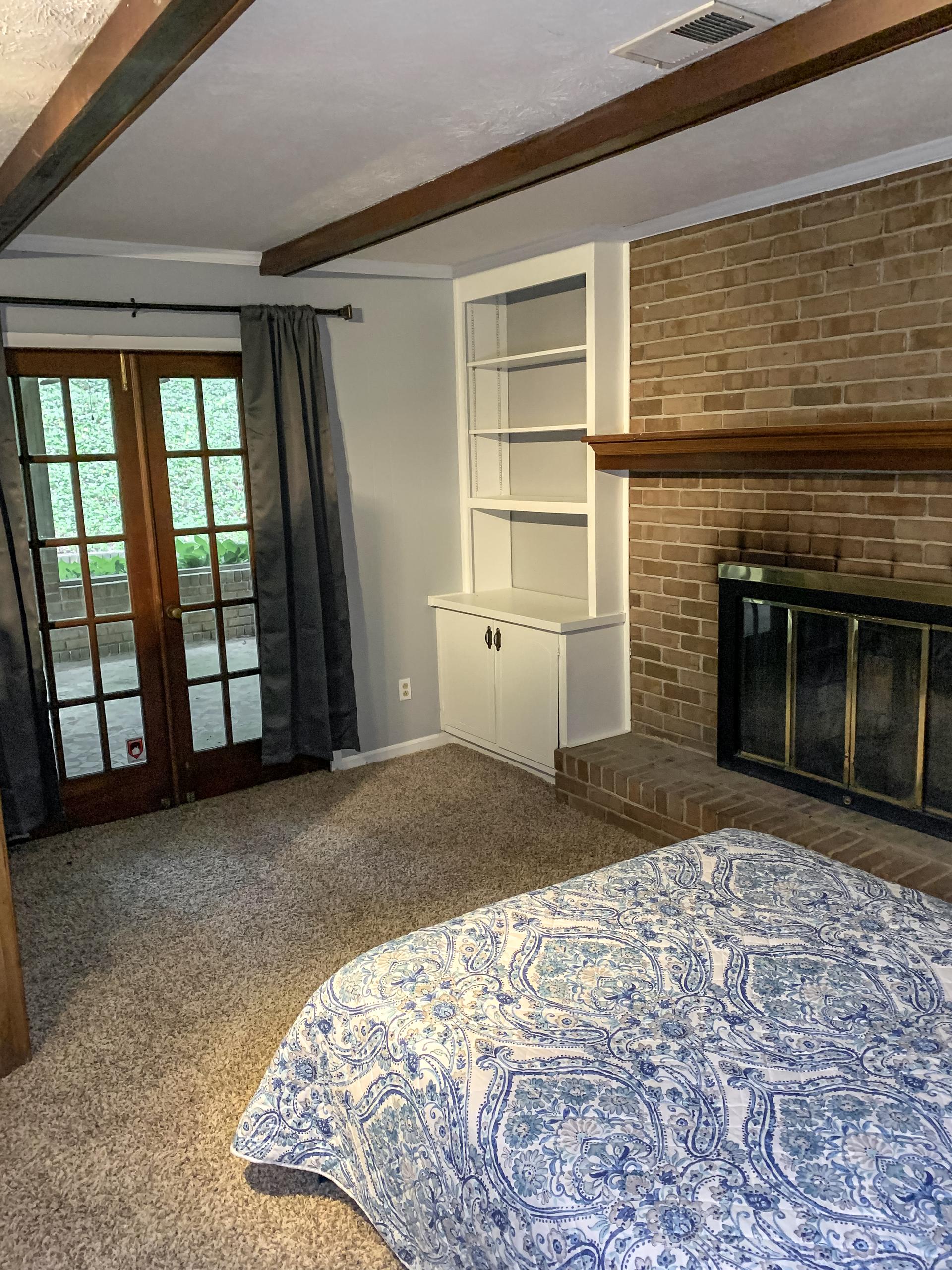 bedroom, detected: carpet, bed, window blind, kitchen stove