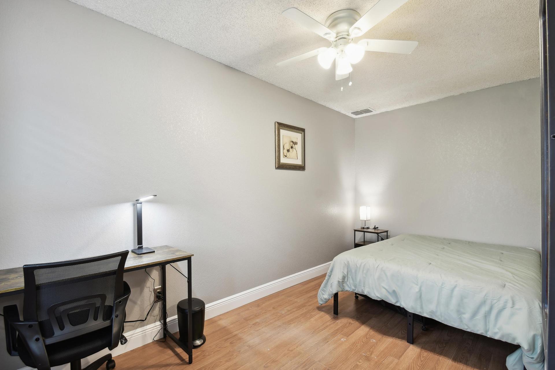 Computer desk, office chair and light