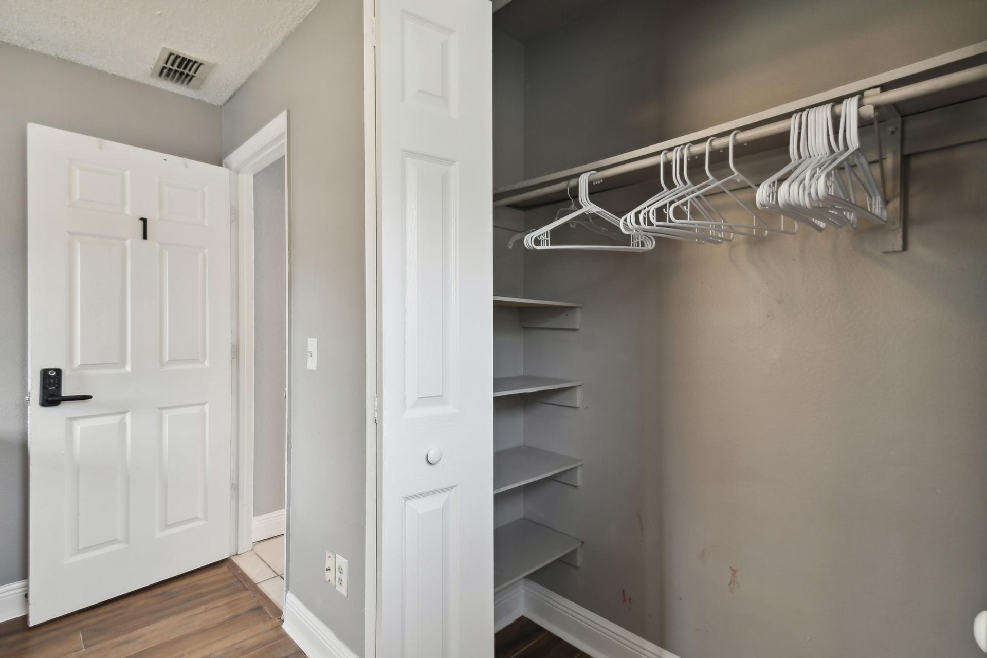 Full closets with extra shelving on each side