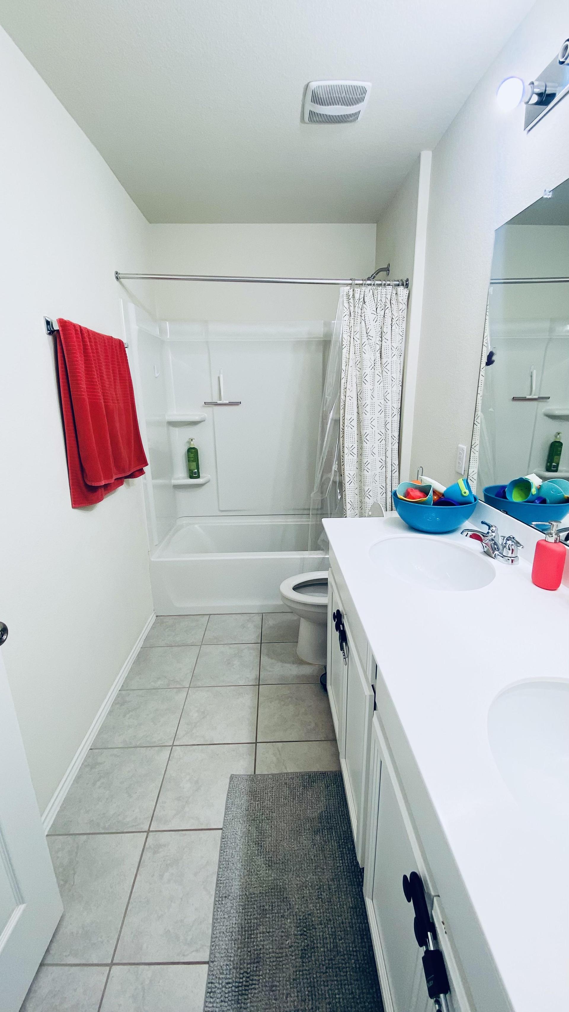 Large shared upstairs bathroom with dual sinks and full tub.  Clean & quiet home.