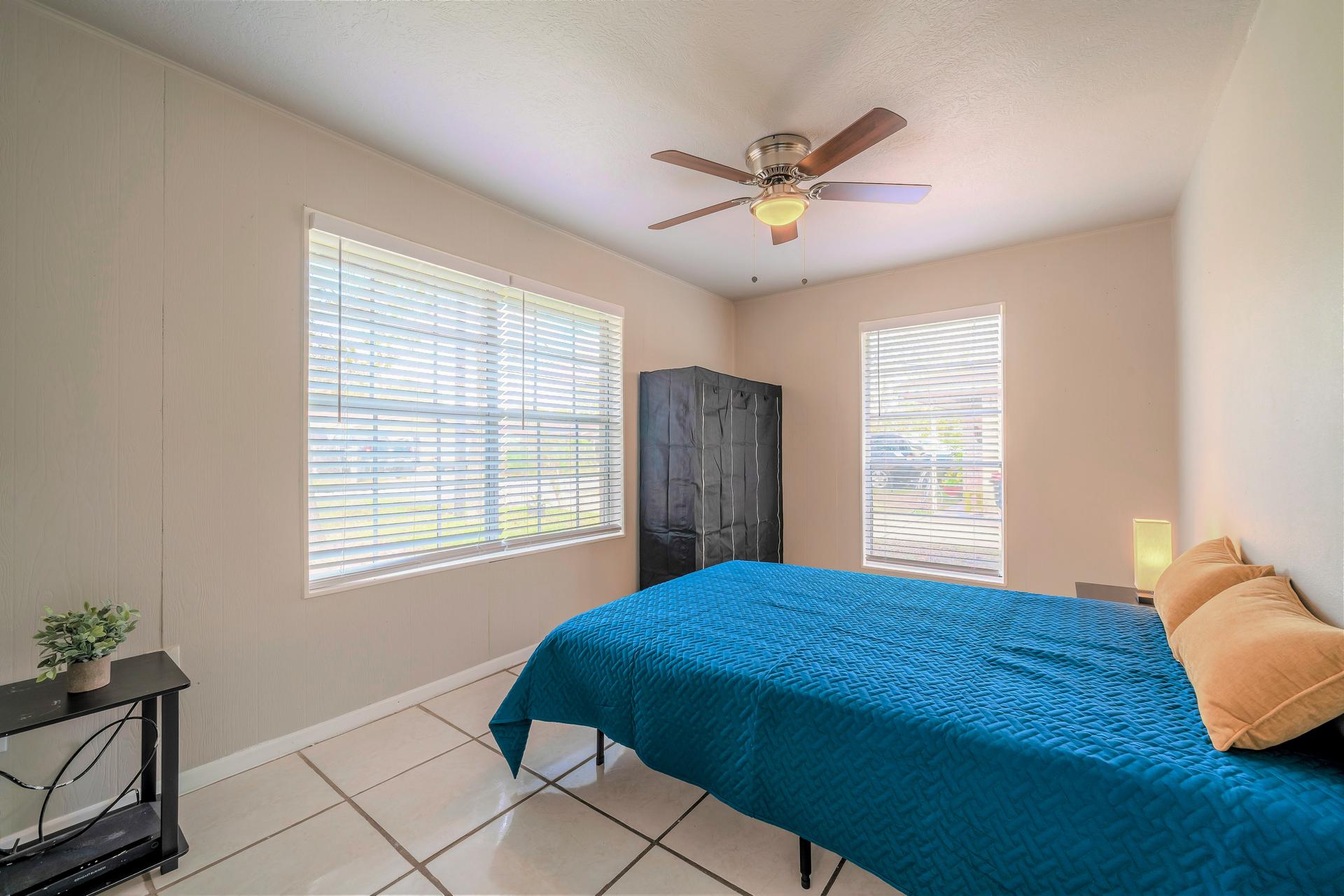 bedroom, detected: window blind, ceiling fan, bed