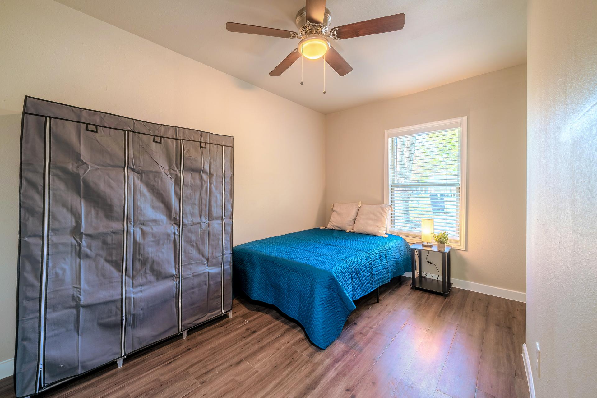bedroom, detected: ceiling fan, bed, window blind