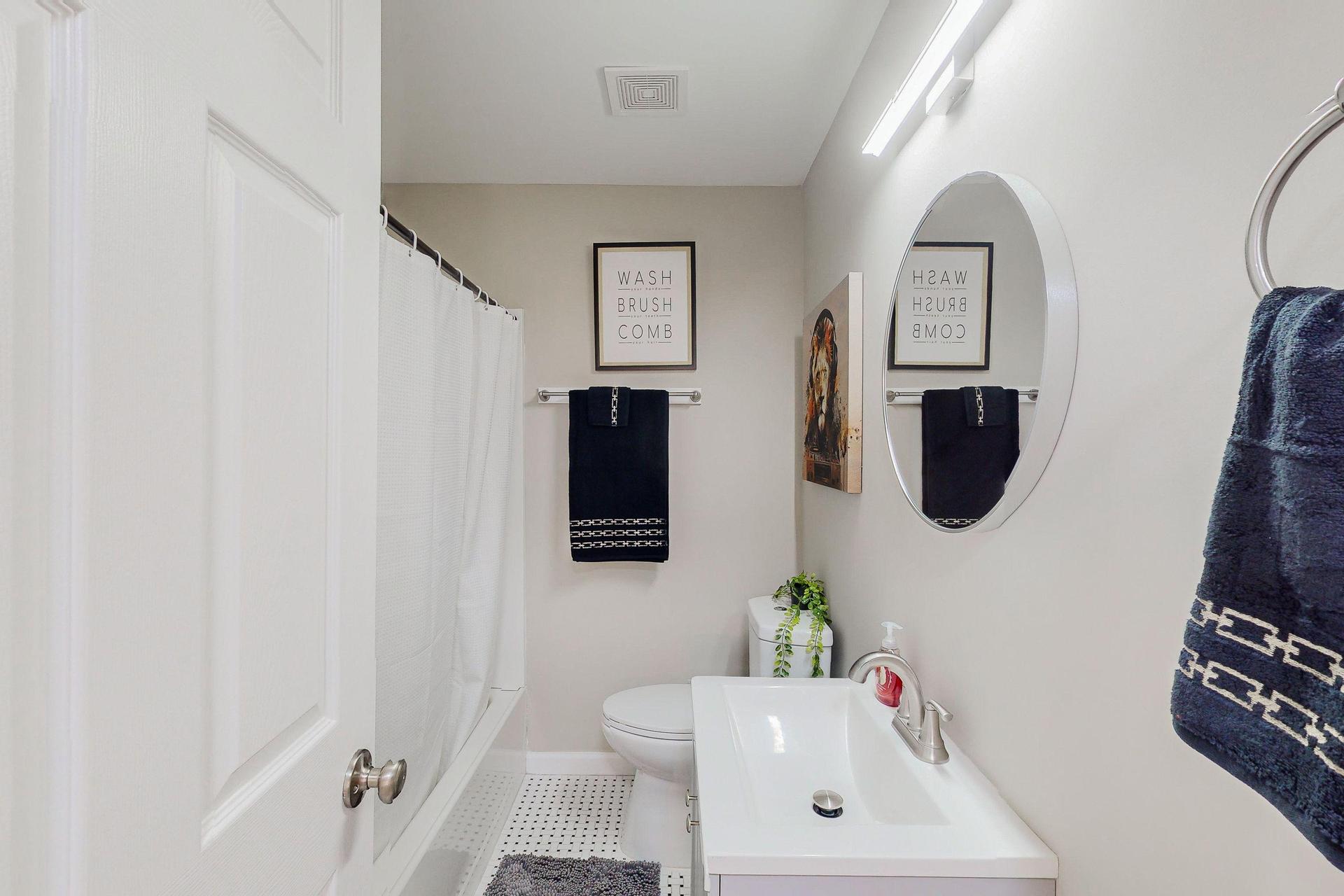 Full bathtub and a shower