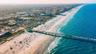 Aerial view of Jacksonville, Florida beach with clear blue waters.